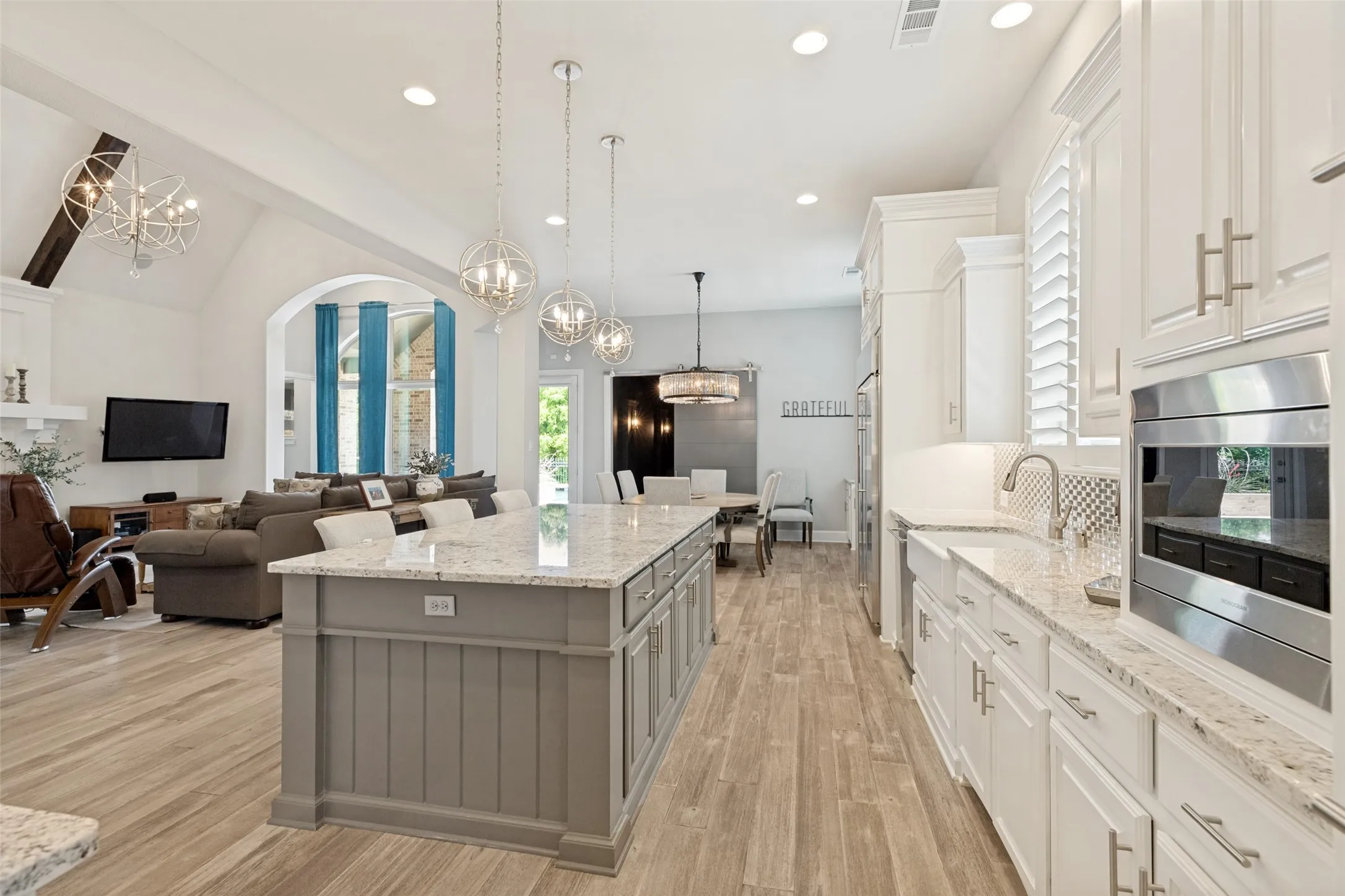 The cabinets contain both a sectioned silverware drawer and a knife drawer.  Recessed lights make the kitchen bright and cheerful.  Everything you want is all together in the huge family room, kitchen, casual dining and media room!