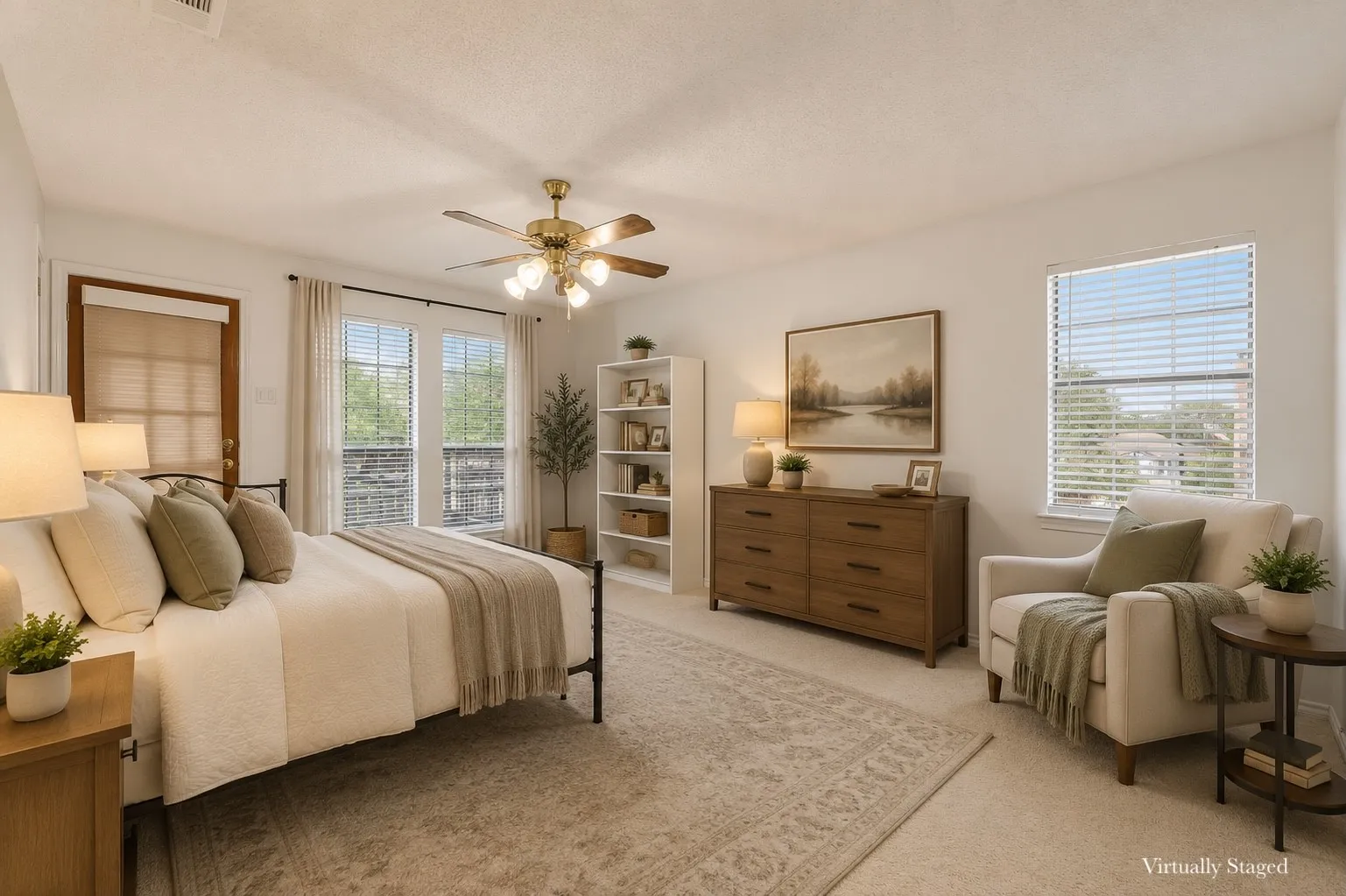 Spacious room featuring light-toned walls and plush carpeting