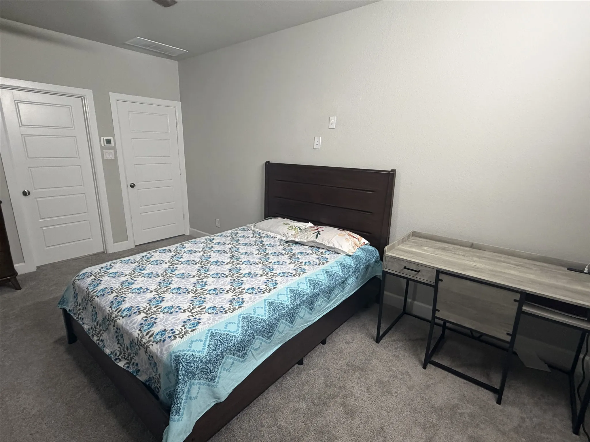 1st Floor Primary Plush gray carpeting extends throughout this room, featuring light gray walls