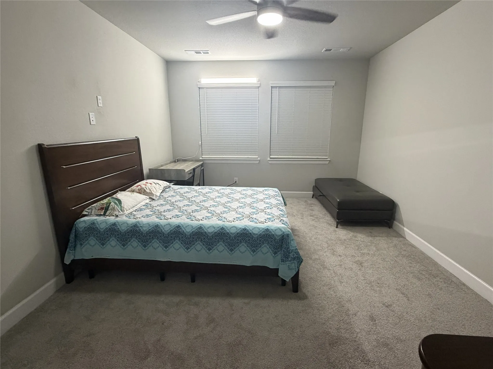 1st Floor Primary Spacious room featuring neutral carpeting and light-toned walls