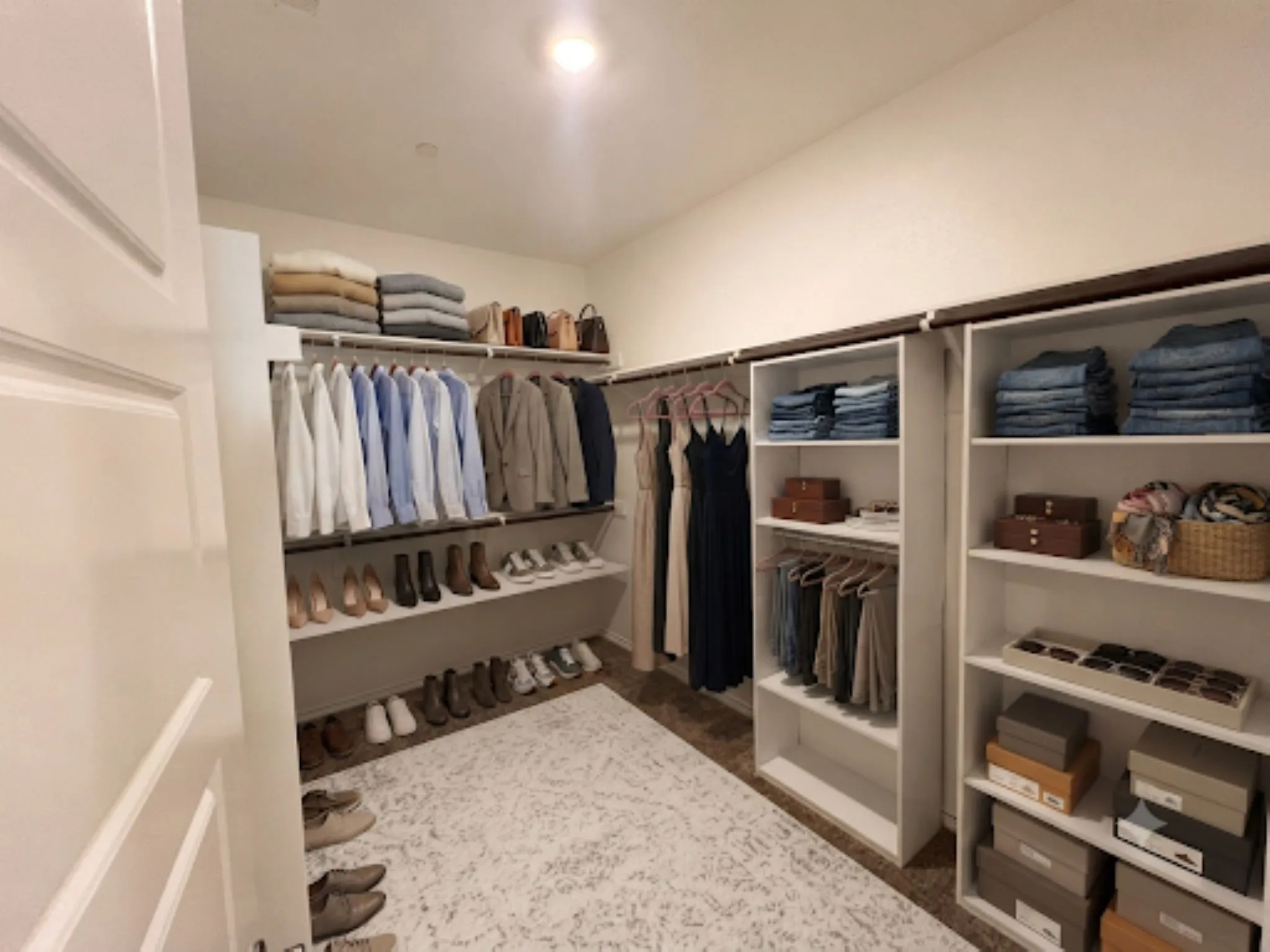 Virtually staged master closet to show its size and configuartion