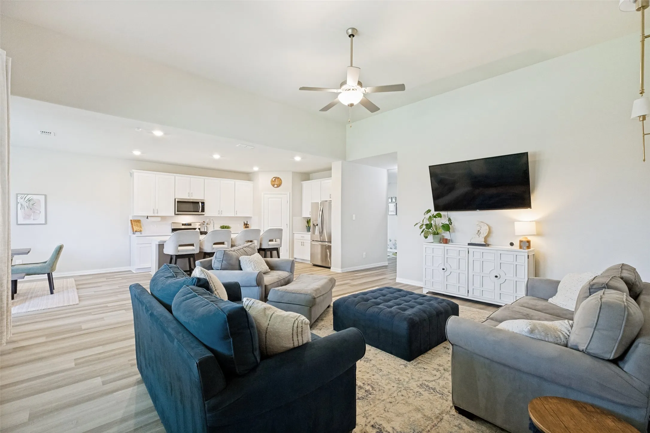 Open to kitchen and dining area