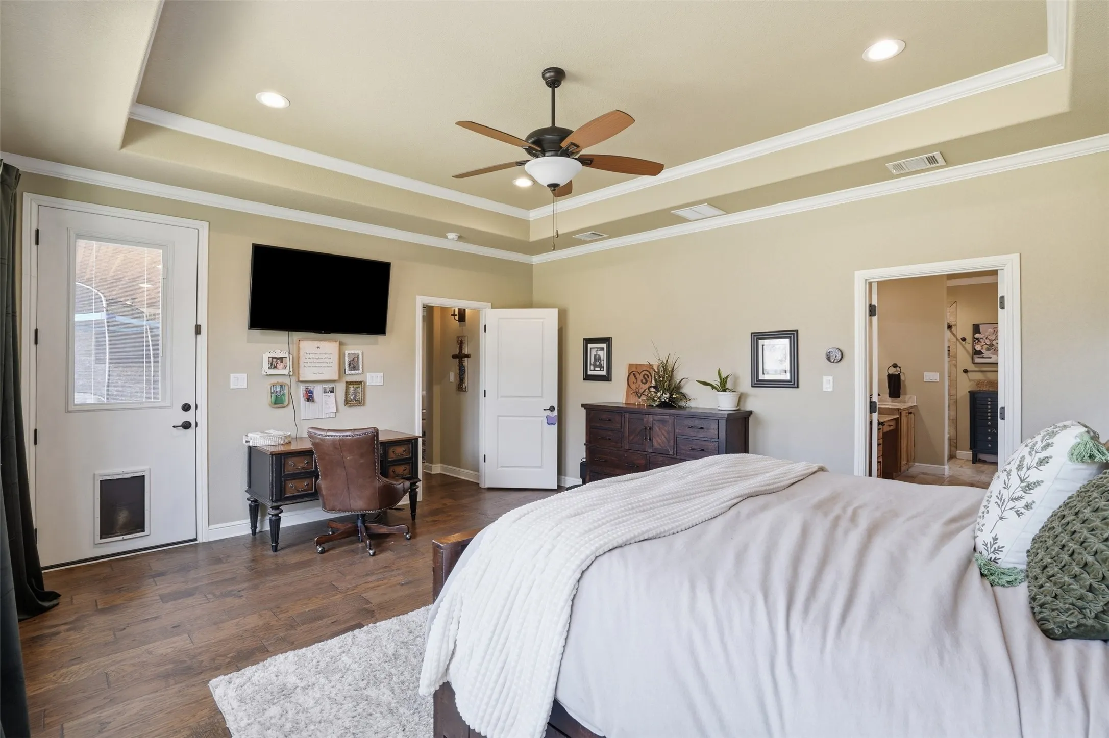 bedroom is open and airy with access to back porch.