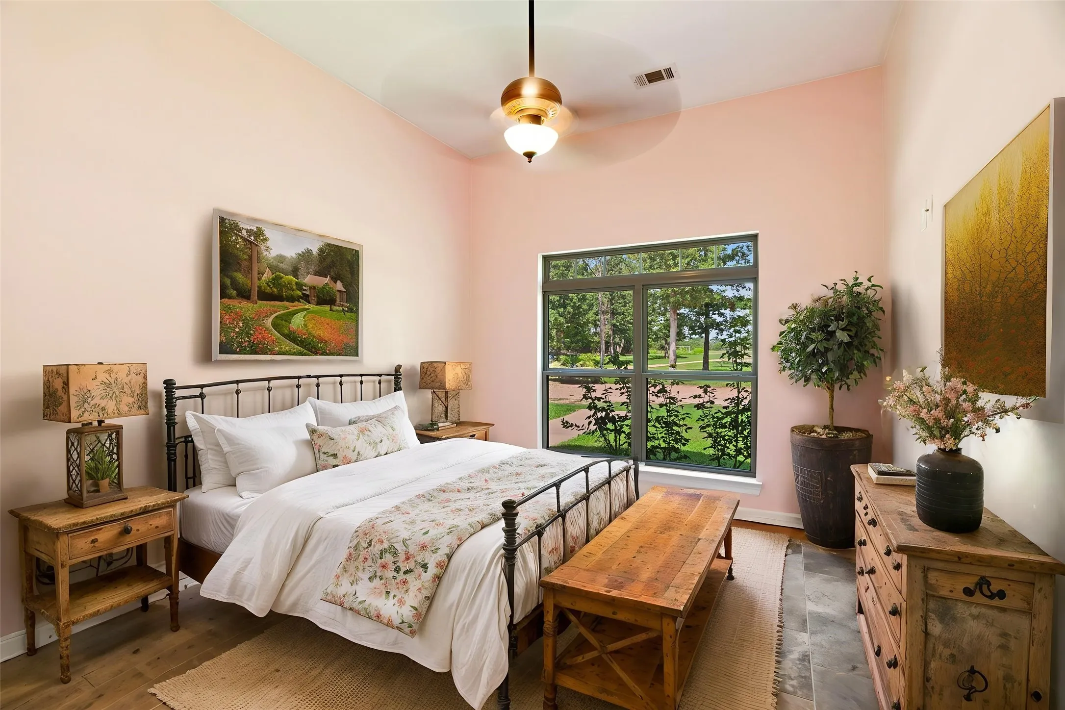 Spacious room featuring a vaulted ceiling and a ceiling fan with integrated lighting