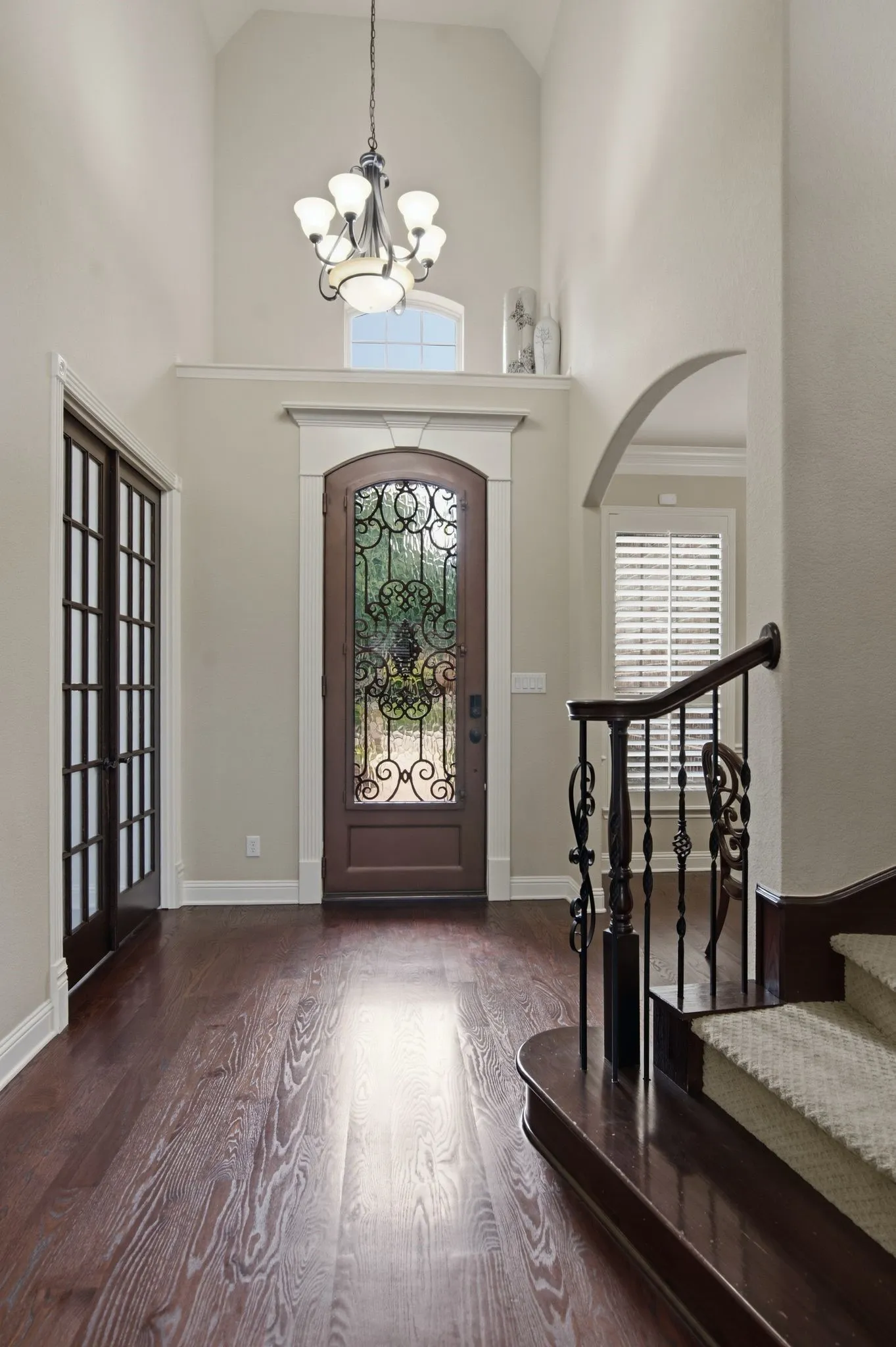 Gorgeous Iron and glass door welcomes you home.