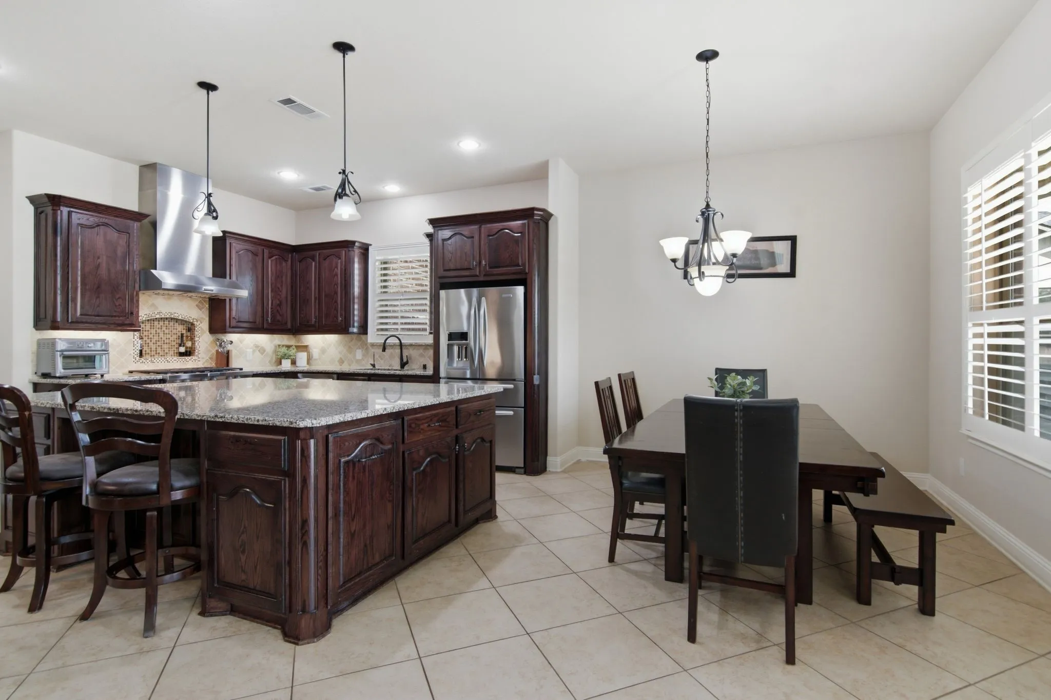 The breakfast area overlooks the backyard. This home has a complete home filtration system and reverse Osmosis water​​‌​​​​‌​​‌‌​‌‌​​​‌‌​‌​‌​‌​​​‌​​ system.