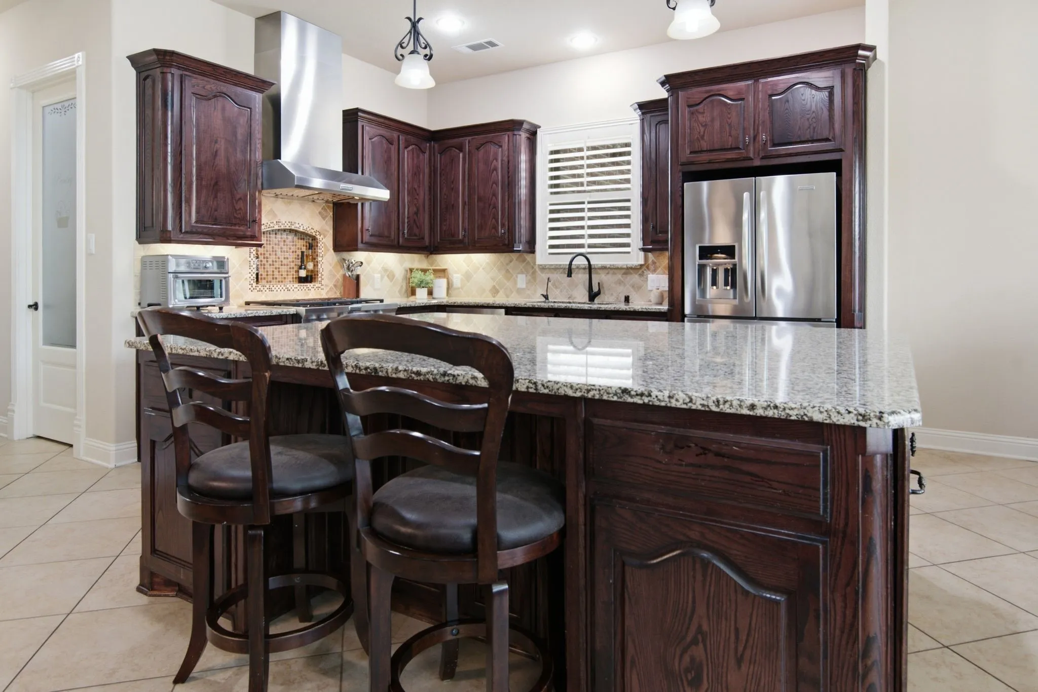 Oversized kitchen island, a great place to gather. Large walk-in pantry.