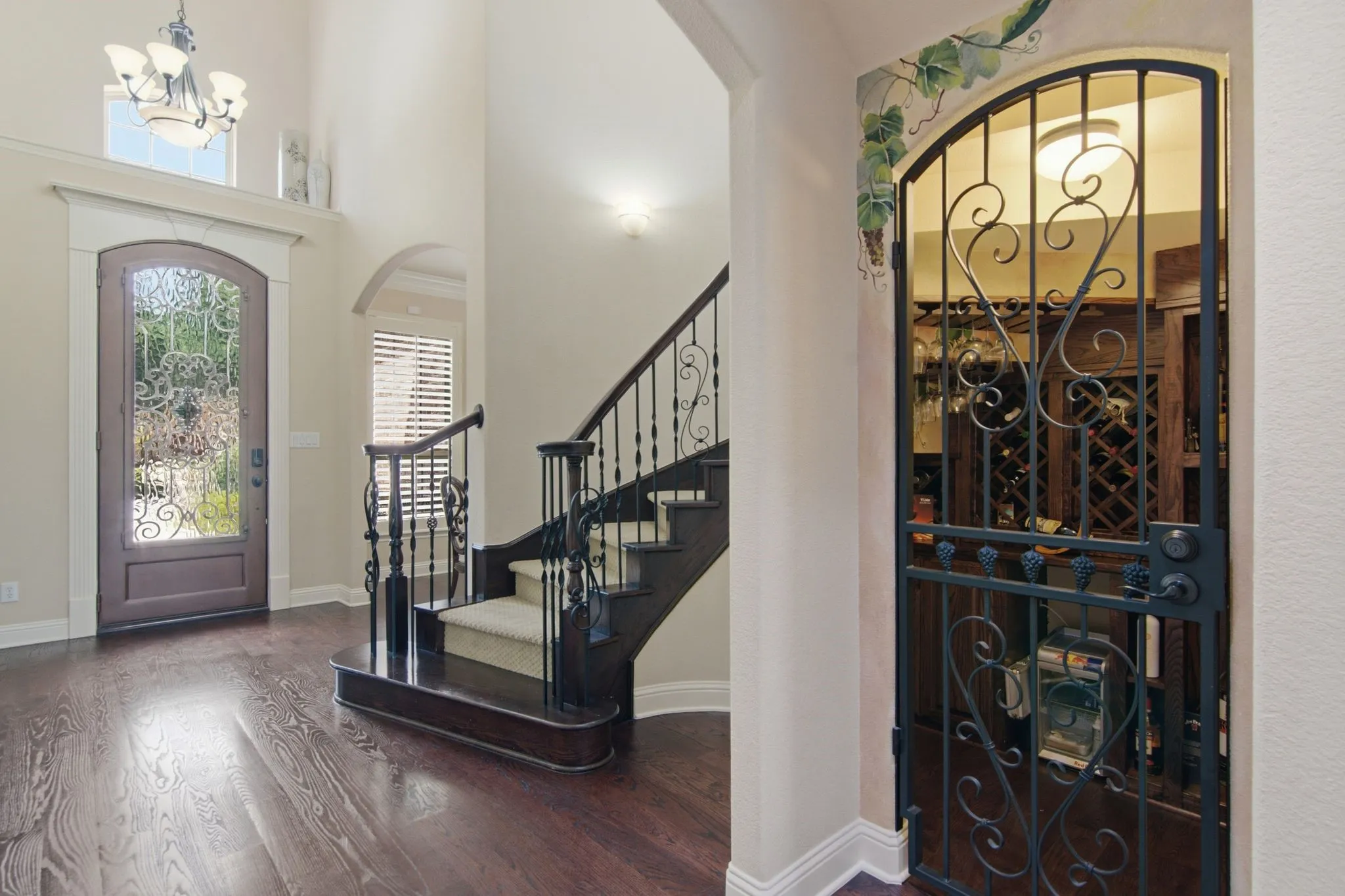 Wine room/storage with iron entry. Full secondary bath downstairs for your guests.
