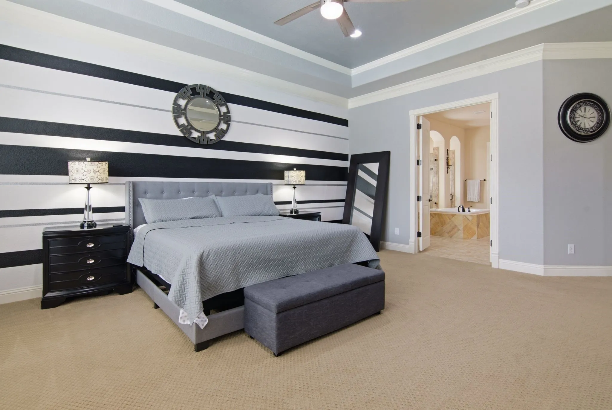 Beautiful tray ceiling window seat and crown molding.