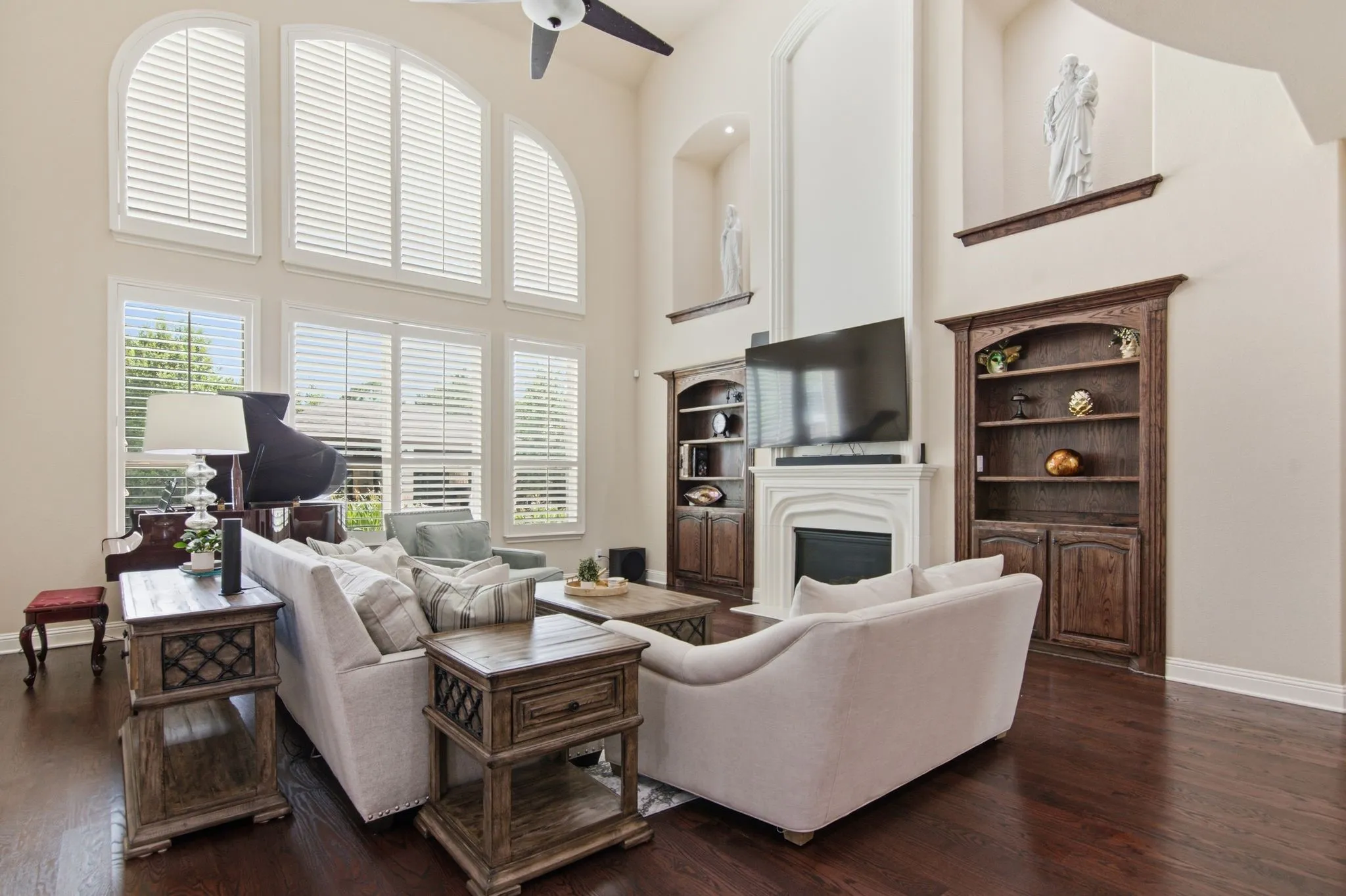 Open and spacious family room with wall of windows overlooking the picturesqueview of the serene pool.