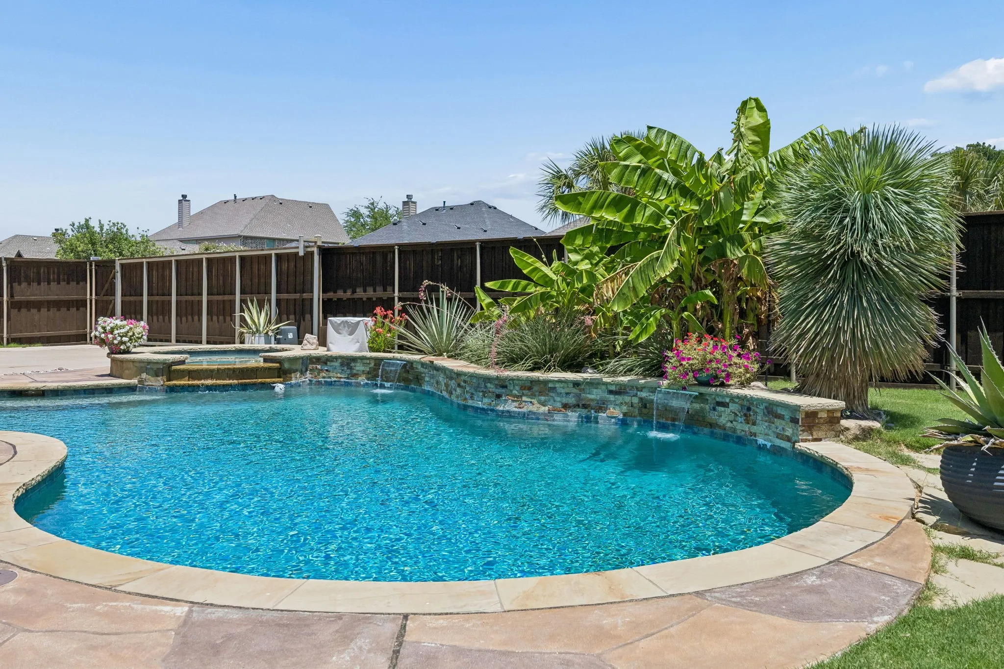 Gunite pool with spa and a zero entry.