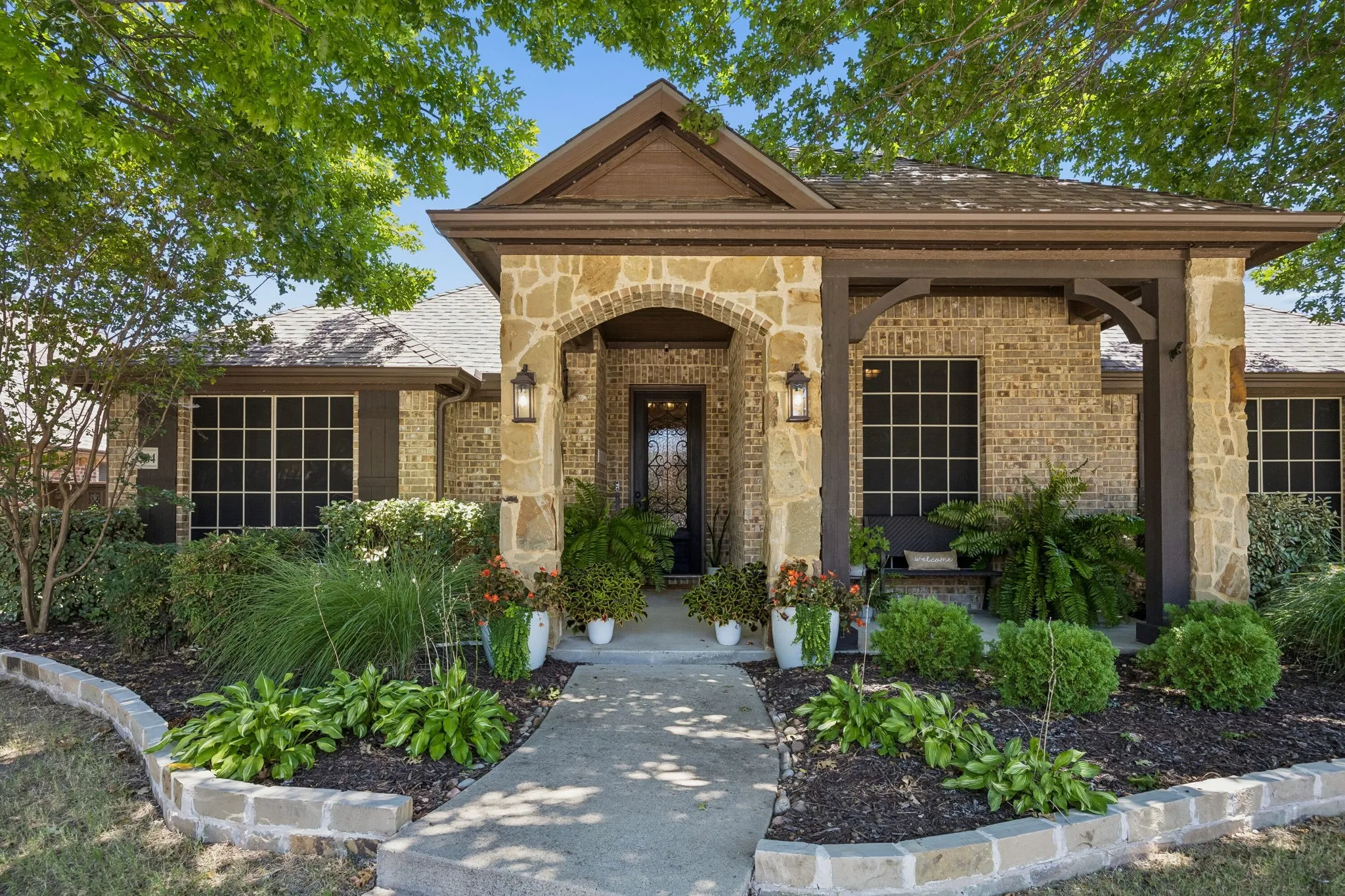 Lush, warm and inviting entrance.