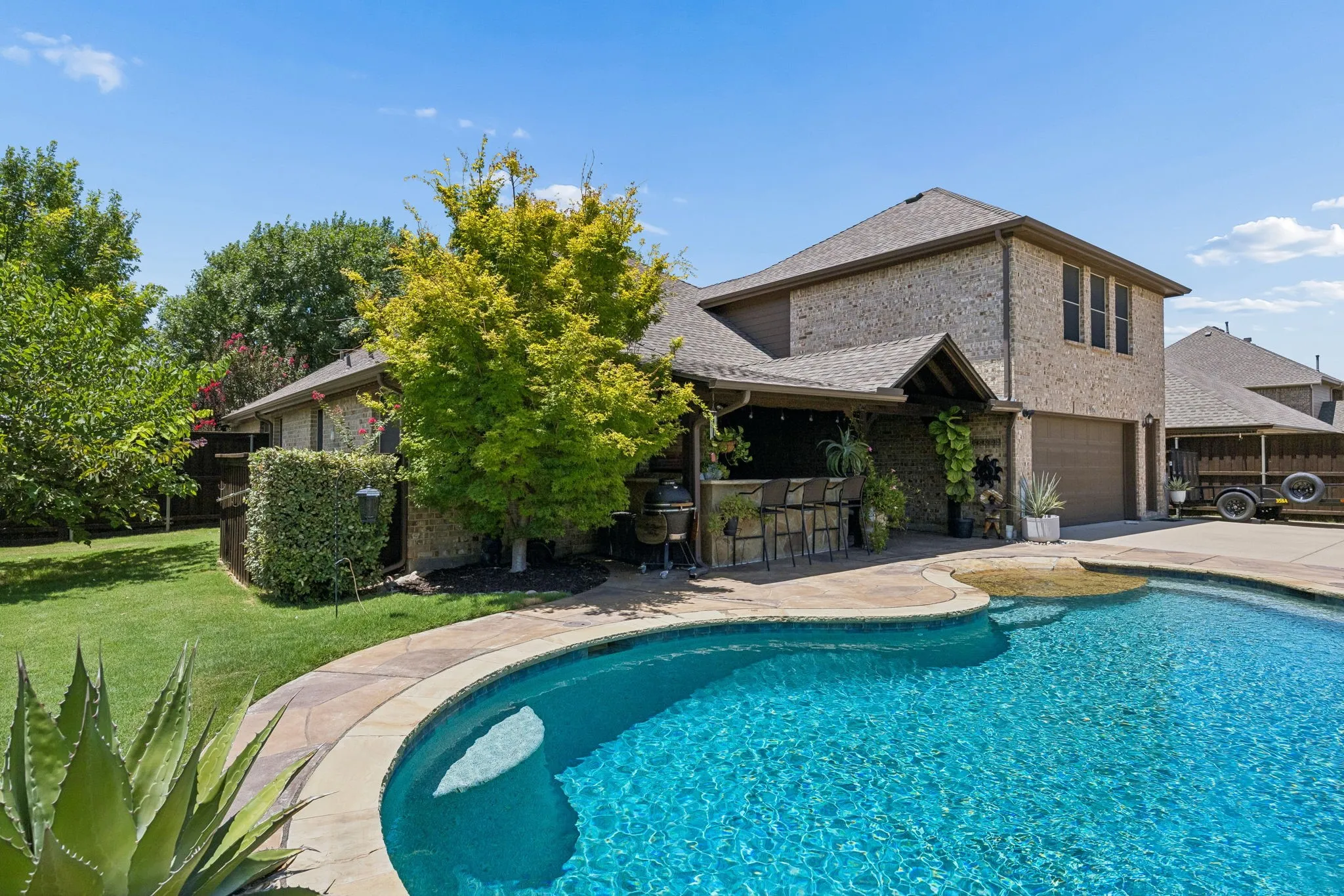 Gunite pool with spa and a zero entry.