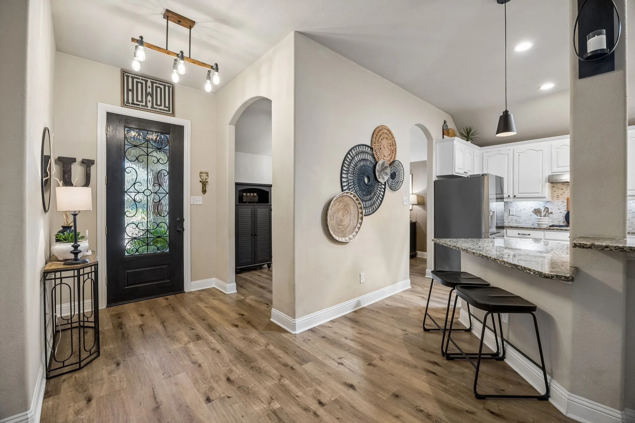 From the front door you're greeted with a formal dining room (center of pic entry and attached to kitchen). Which could also make a great office.