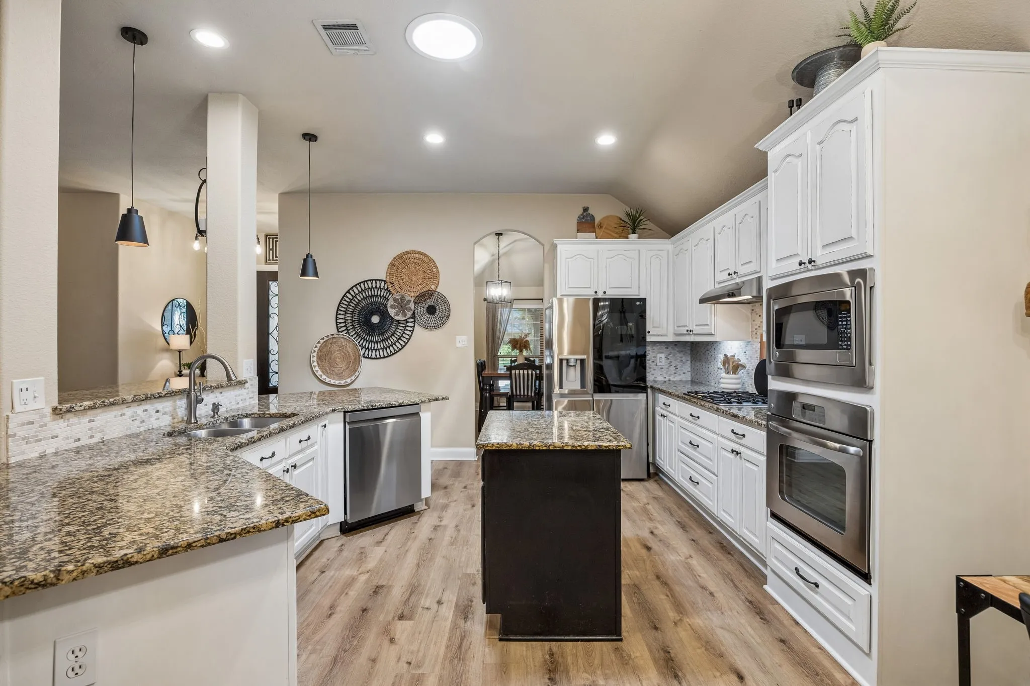 This kitchen has so much cabinet and counter space perfect for family cooking or entertaining for large gatherings.