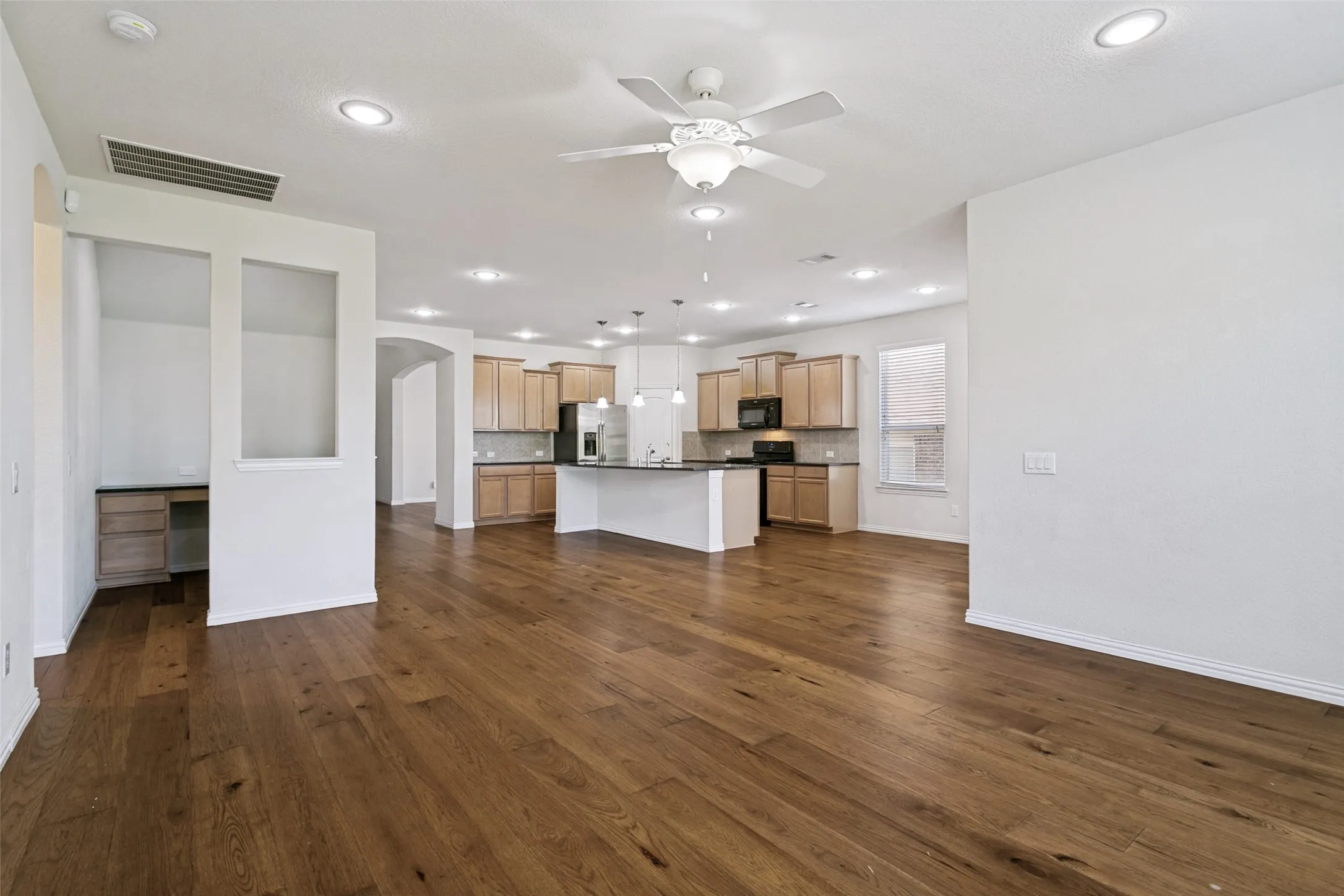 Spacious interior featuring wood-finish flooring throughout