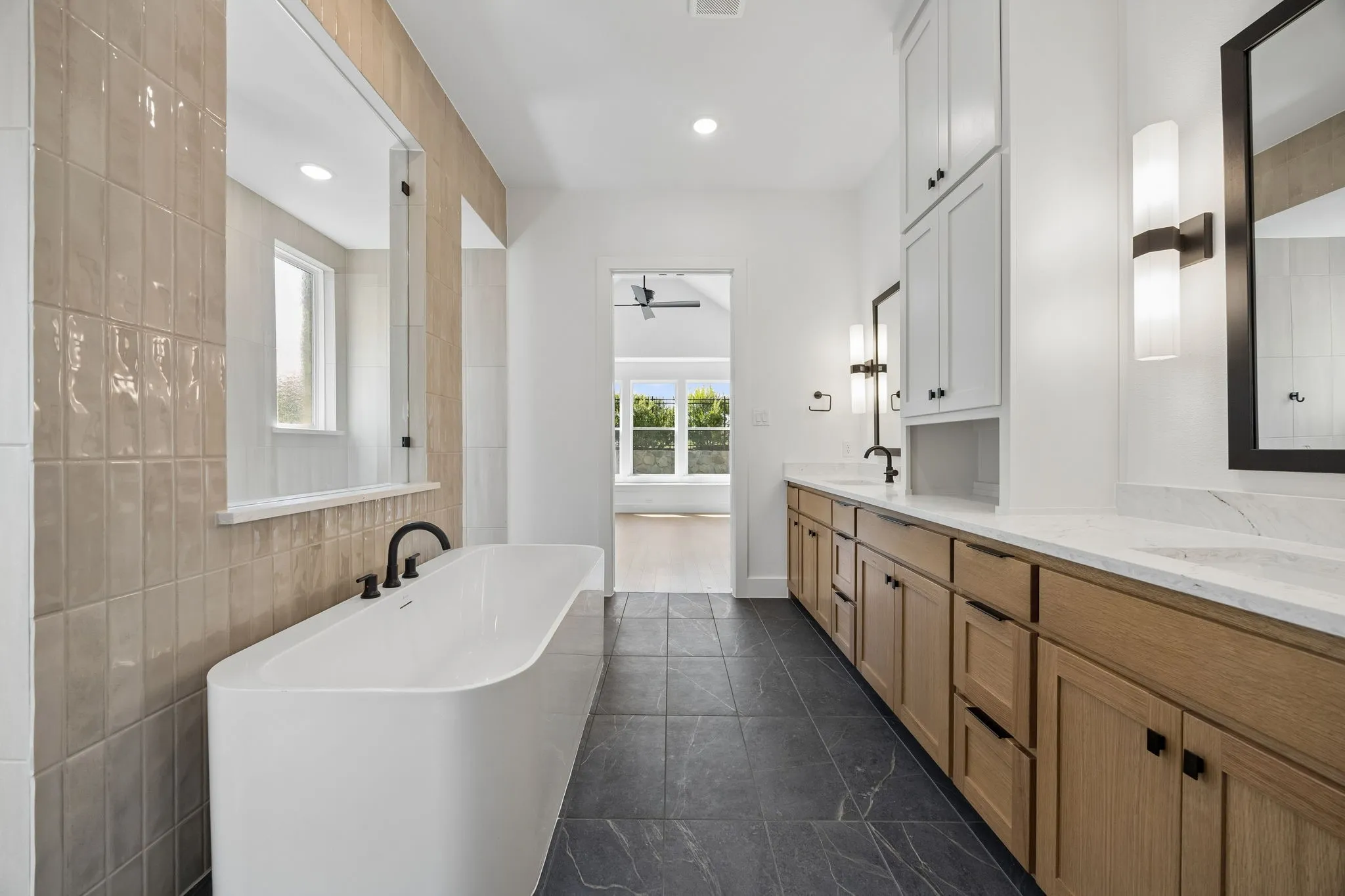You'll enjoy a spa like experience every day in this over the top owner's bath featuring freestanding tub and double walk through shower.
