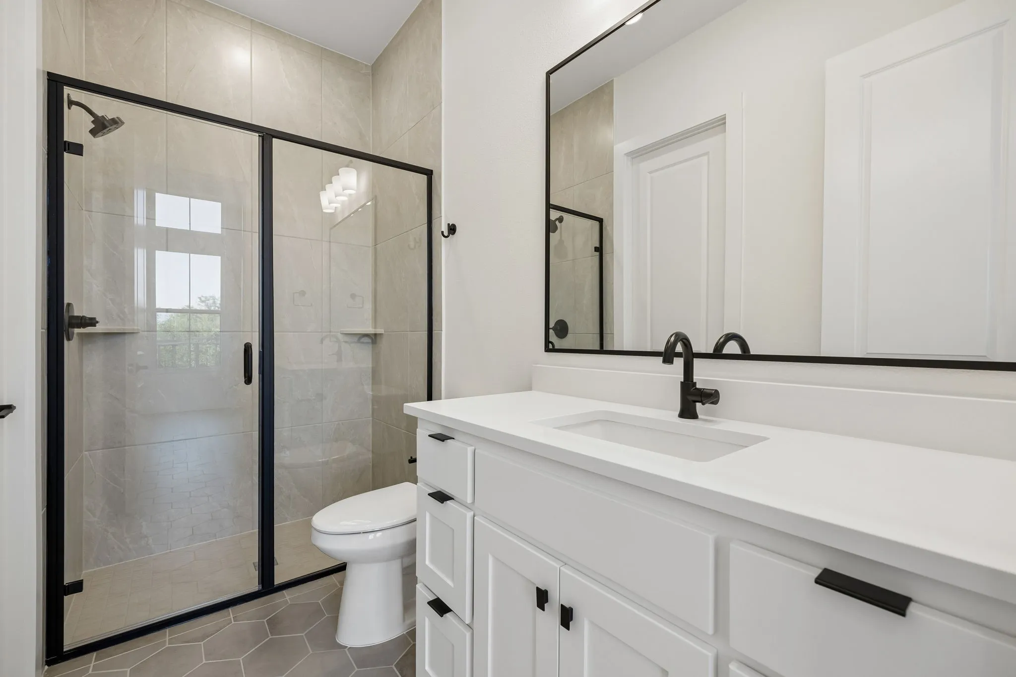 Friends and family will feel right at home in any of the beautifully finished guest baths offered in our Hayden plan.