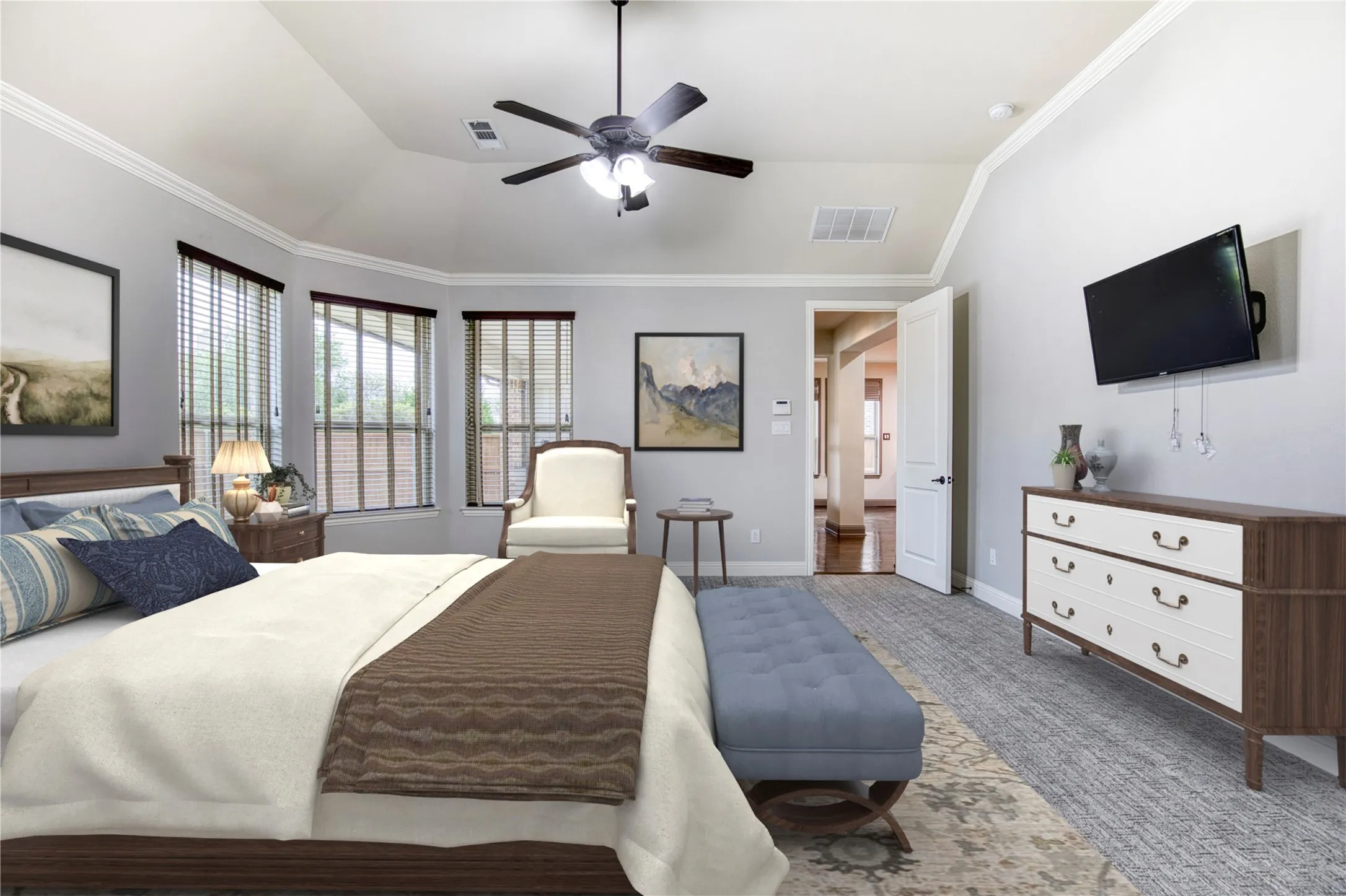 Primary suite tucked away in the back of the home overlooking the backyard.