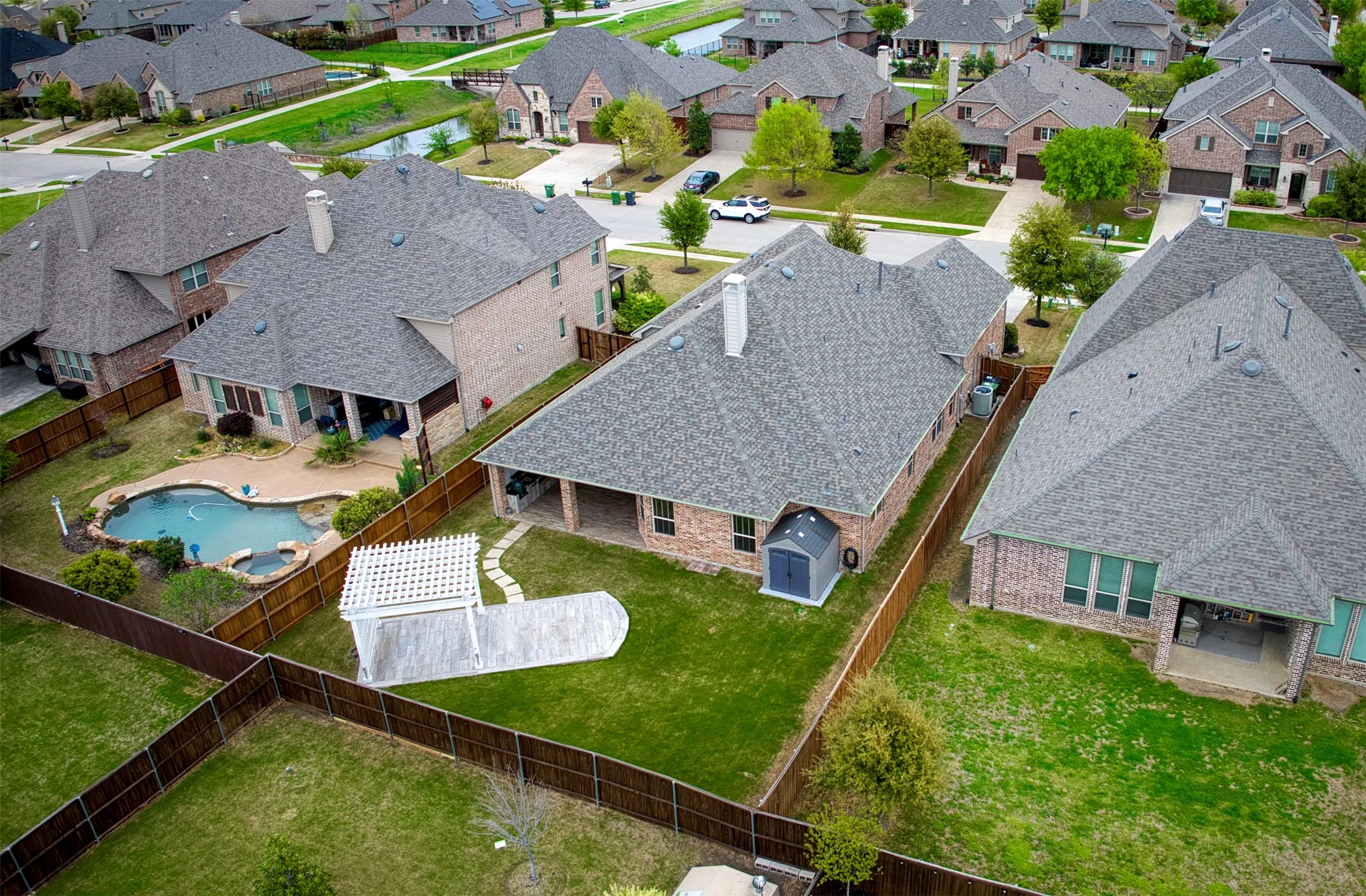 Aerial view of home showcasing backyard.