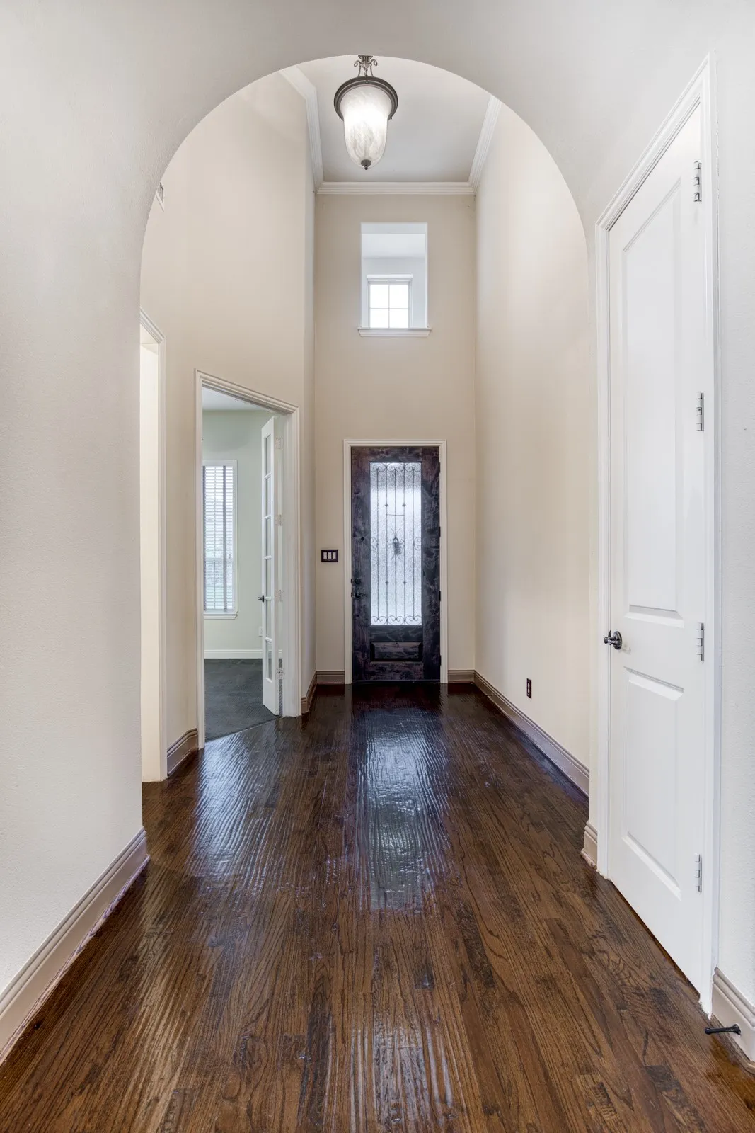 Entry features rich hand scraped, hard wood flooring and soaring ceiling.