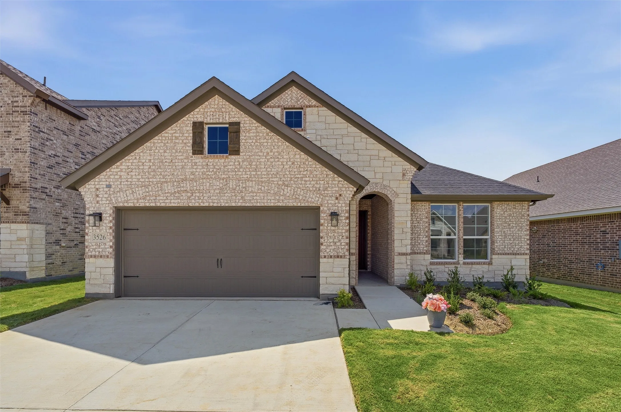 Stone and brick exterior with dark trim accents