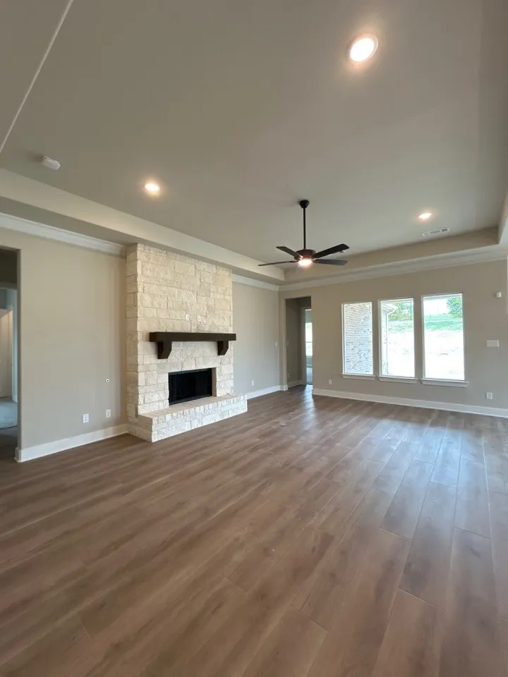 Stone-faced fireplace with a wood mantel