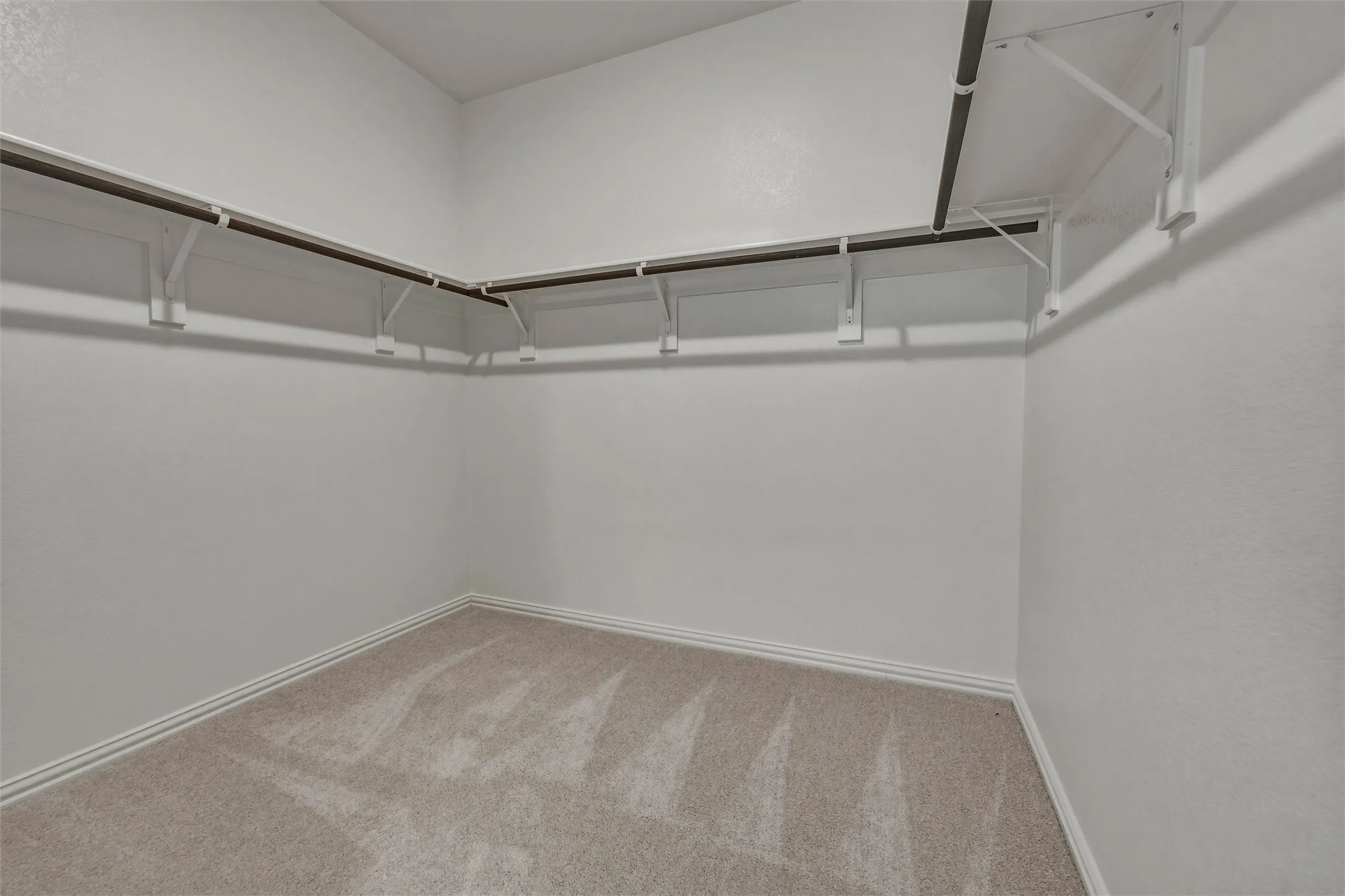 White walls and light-toned carpet