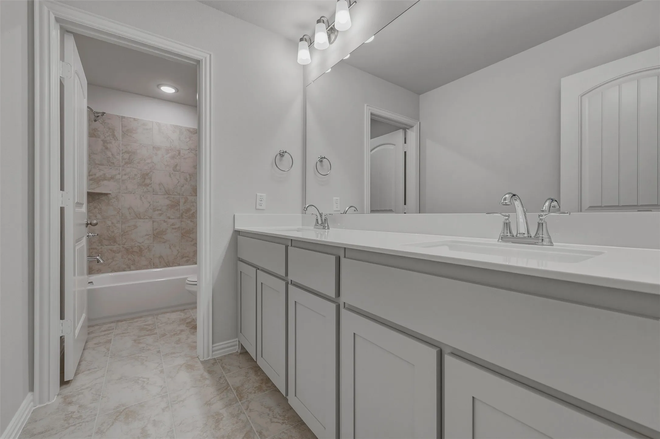 Double vanity with undermount sinks and chrome fixtures