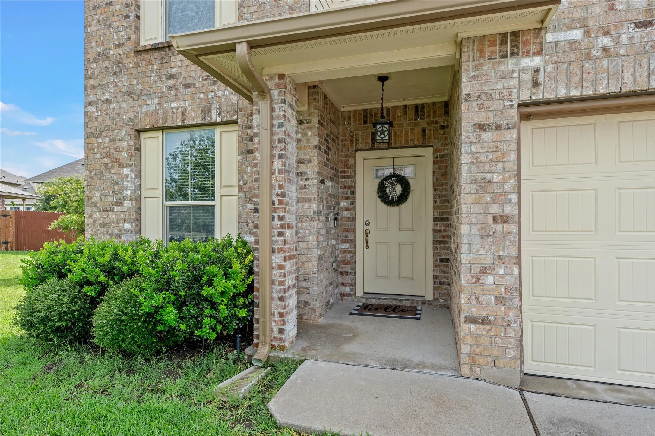 Brick facade exterior with an integrated garage