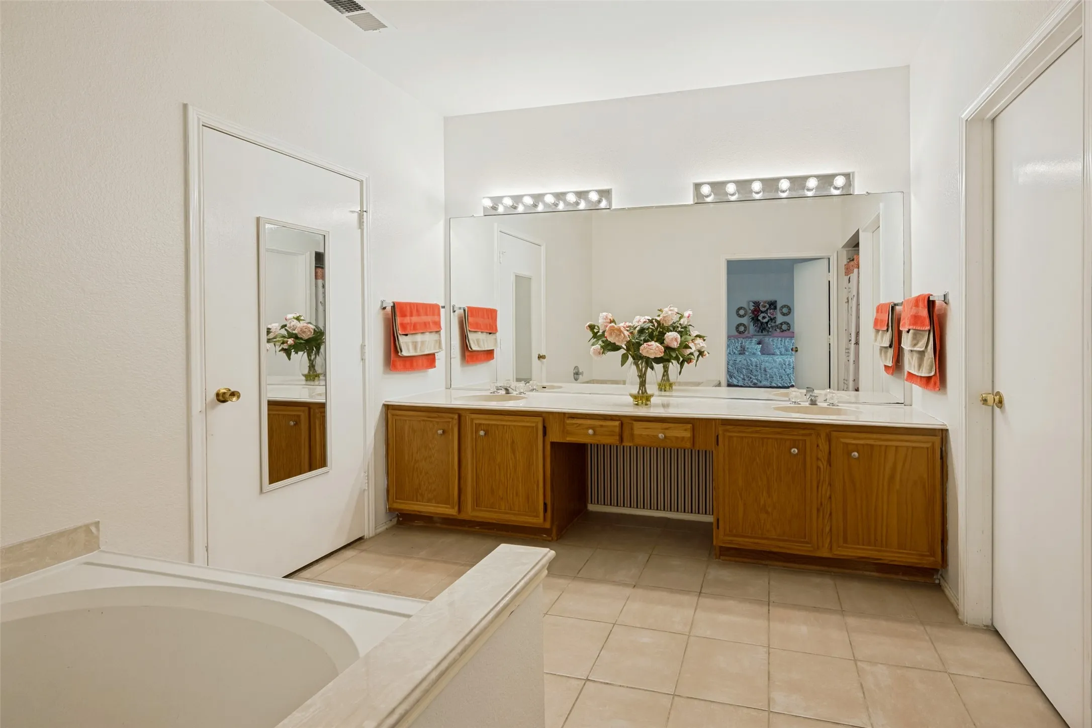 Primary bathroom with dual vanities