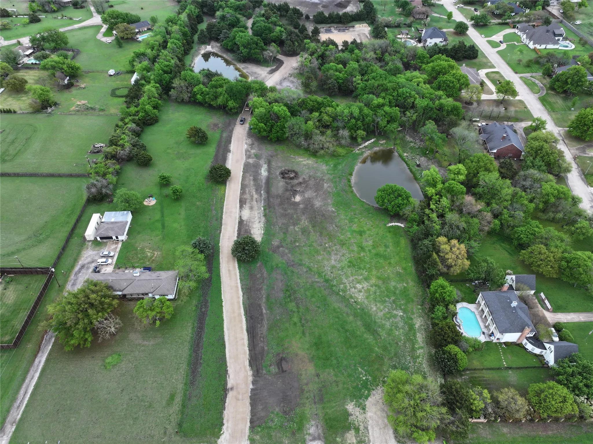 Aerial view of property and surrounding area featuring Lake Ray Hubbard.