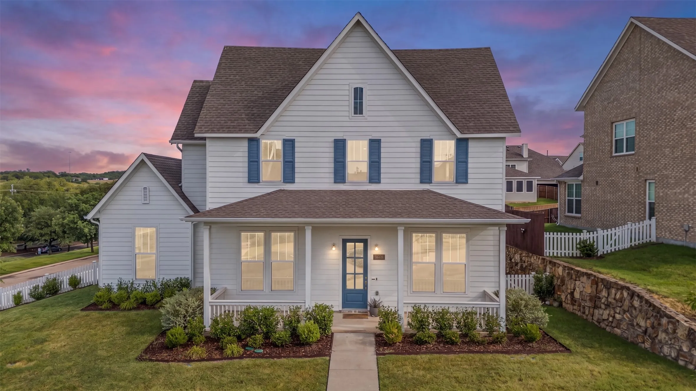 Two-story residence featuring white horizontal siding and a dark shingle roof