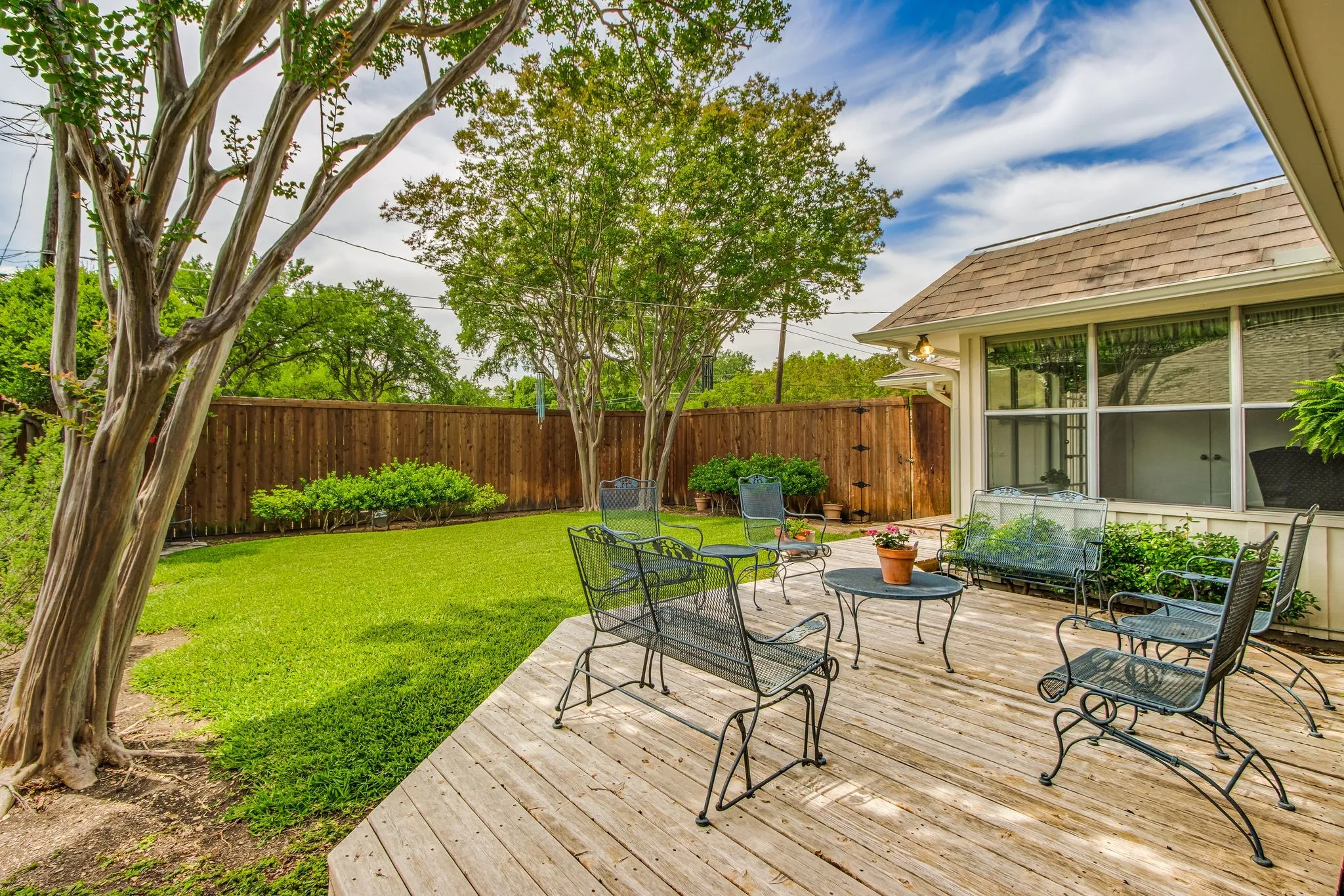 Expansive outdoor deck featuring natural wood planks