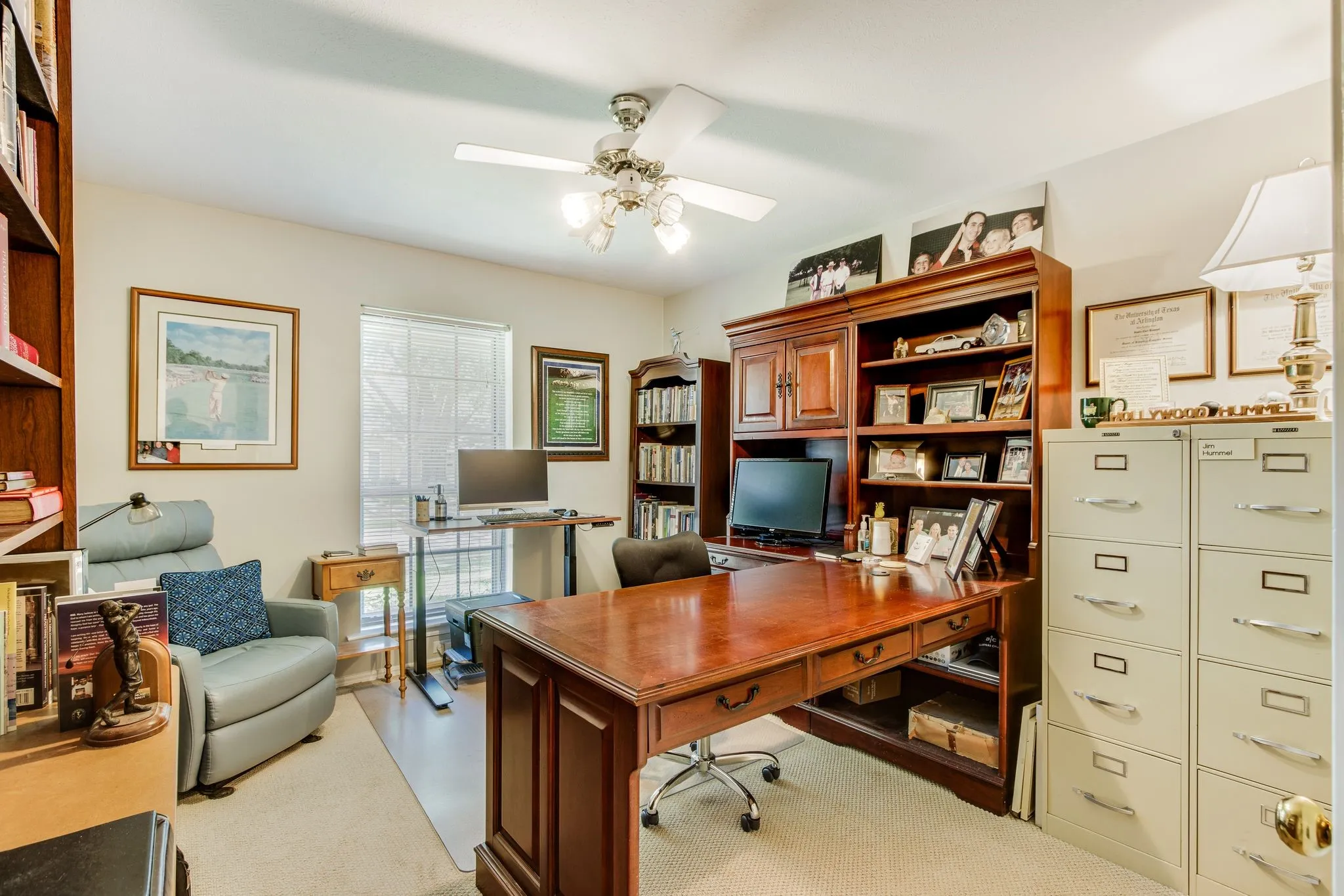 Dedicated room featuring a ceiling fan with integrated lighting, a window with blinds, and light-toned walls