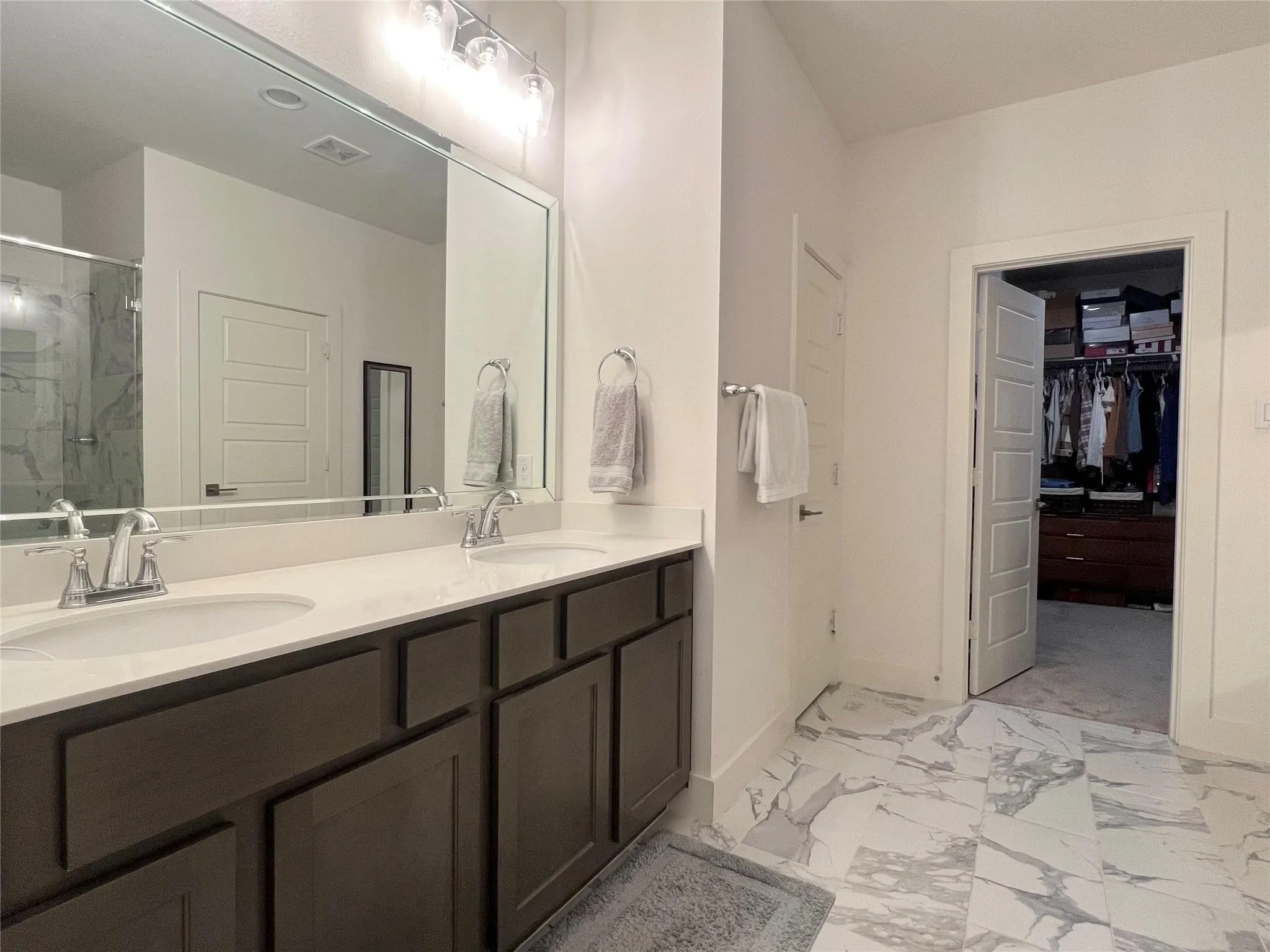 Alternate view of primary bathroom and shower