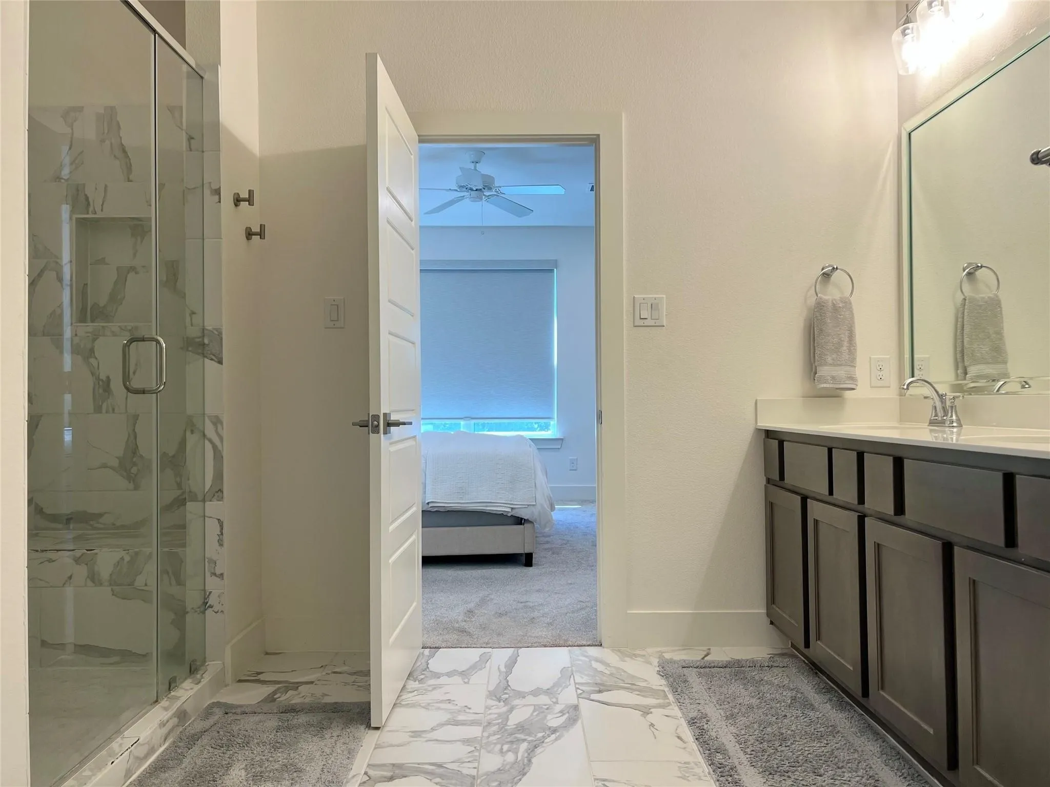 Alternate view of primary bathroom and shower
