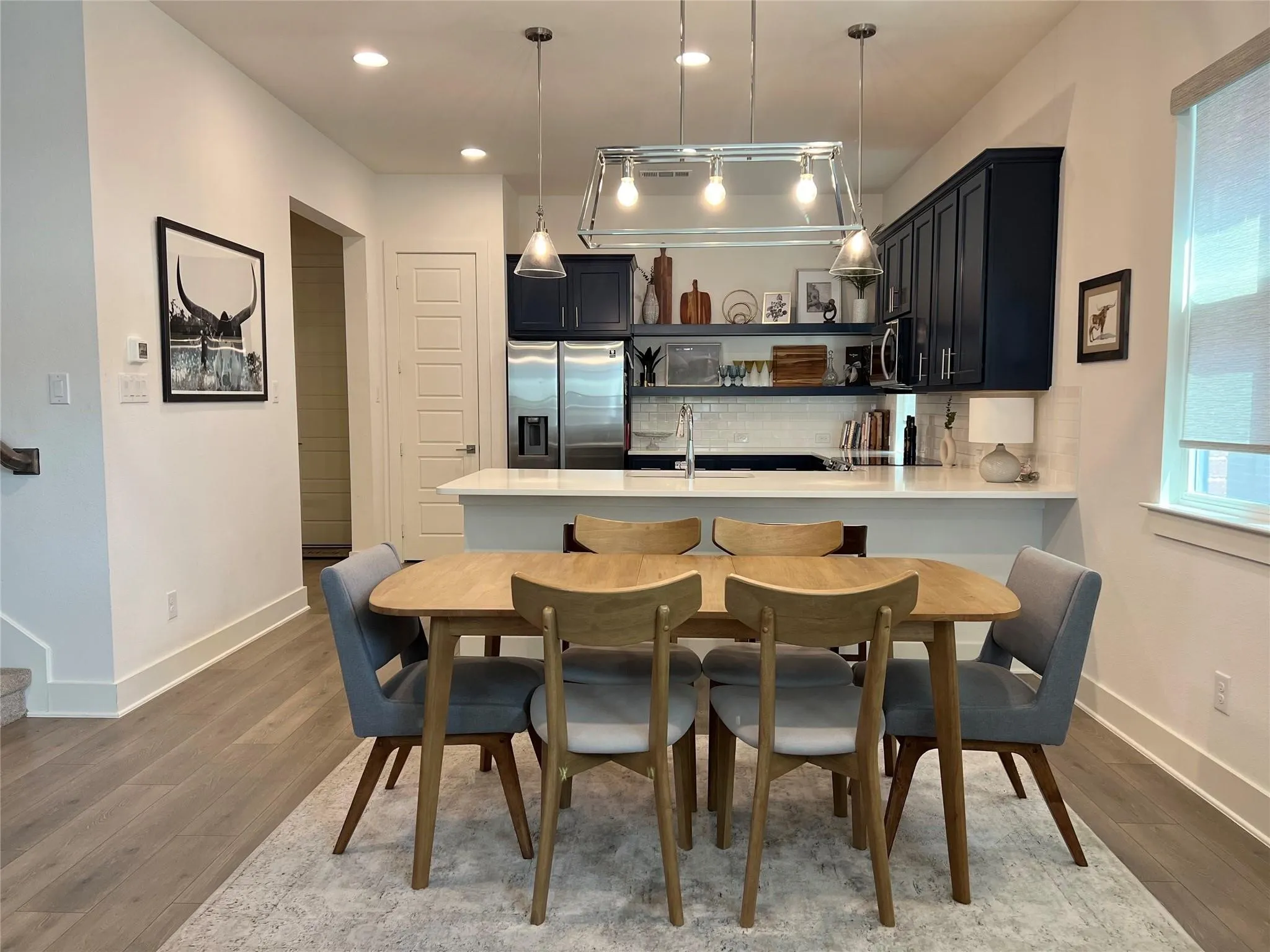 View of dining area and kitchen from start of living area
