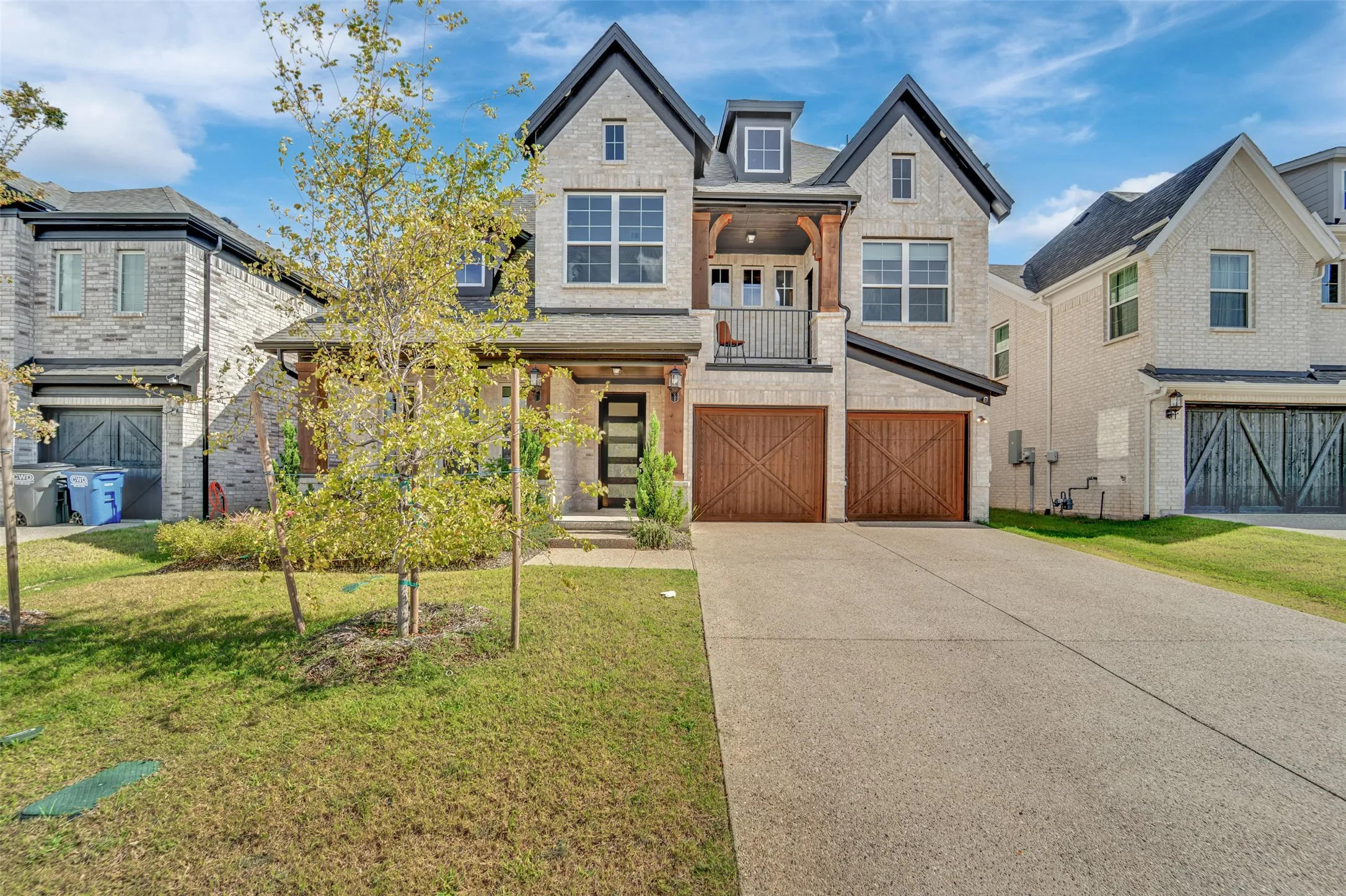 Modern exterior with light brick and dark trim