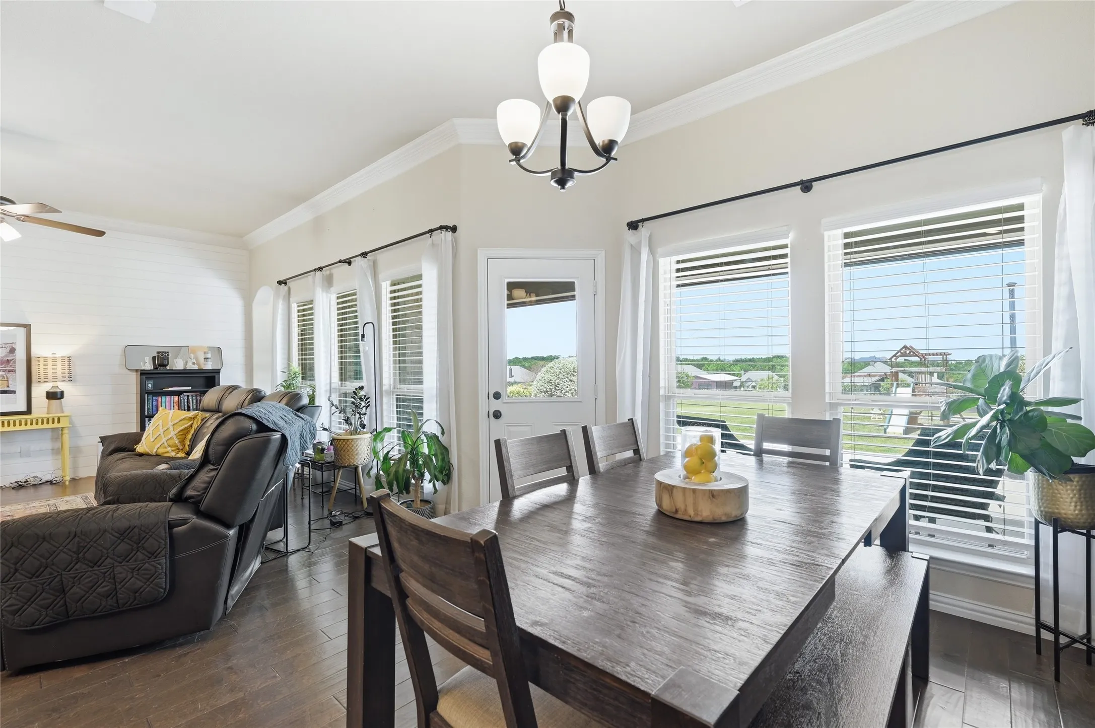 Open concept dining area featuring a wood-finish dining table and bench seating