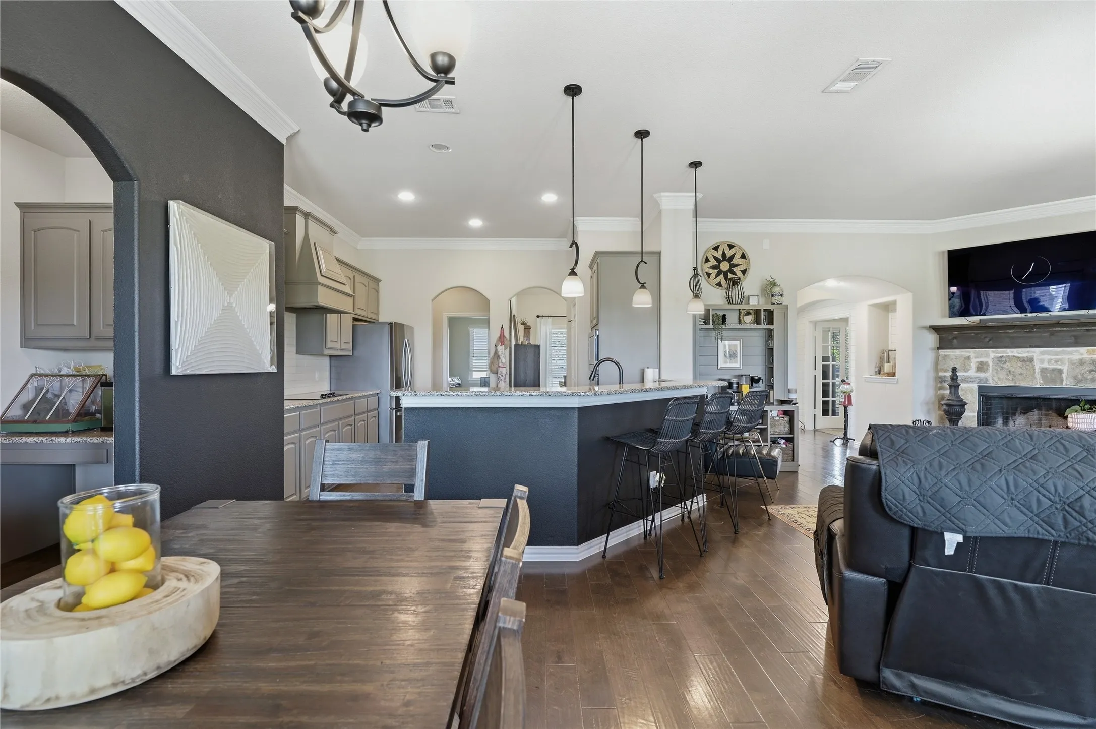 Expansive interior featuring wood-finish flooring and crown molding