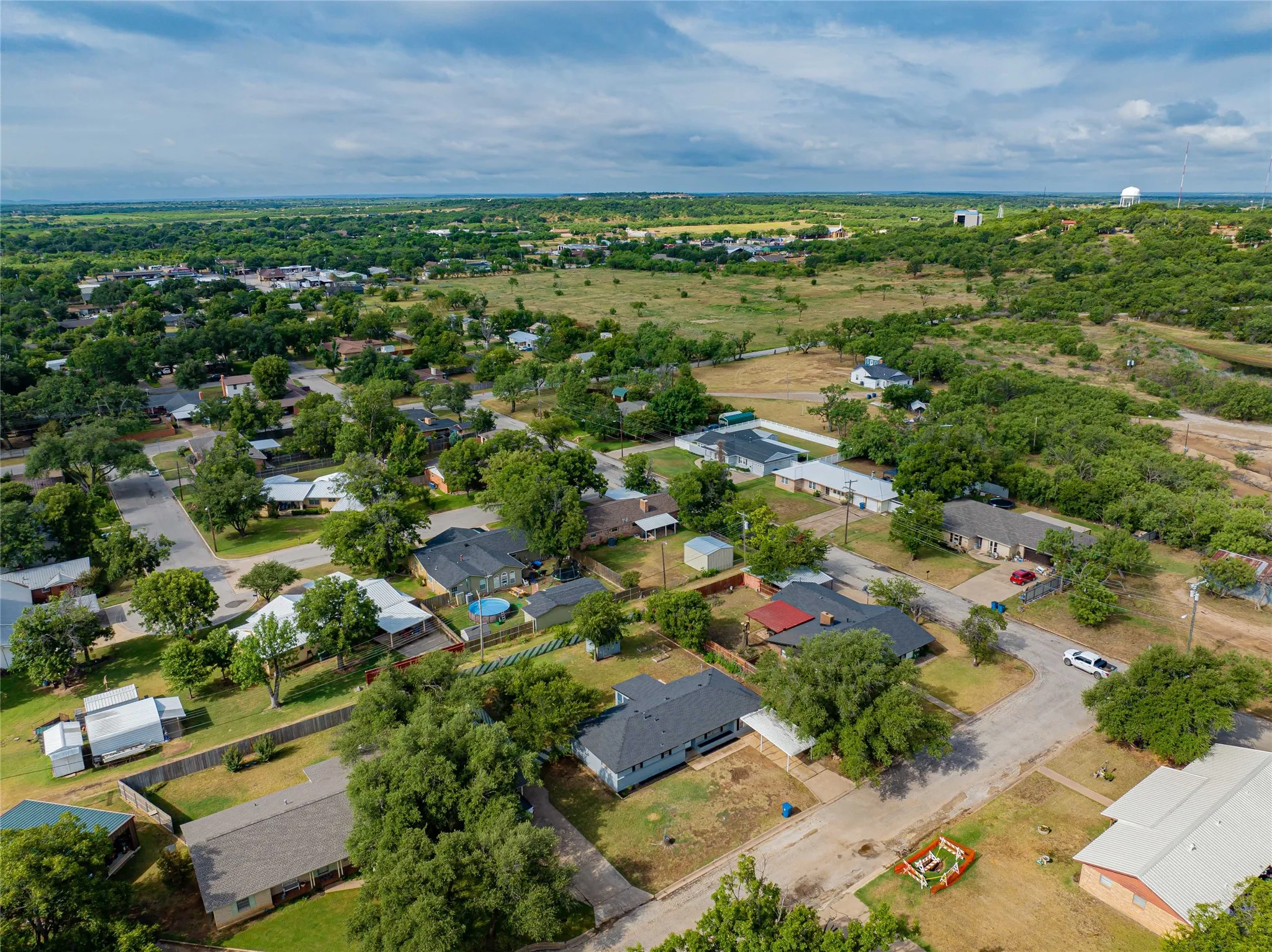 Aerial perspective showcasing the residential area with mature trees and established homes