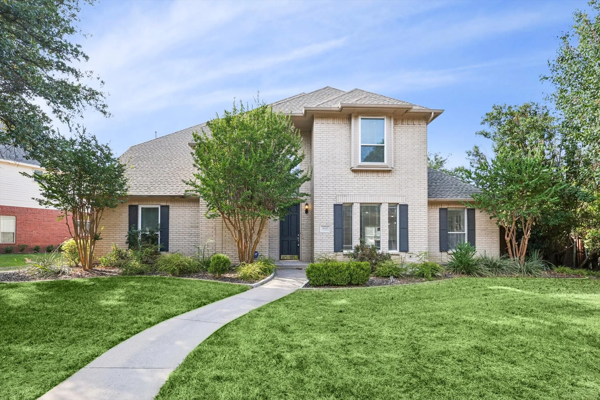 View of front of property with a front lawn