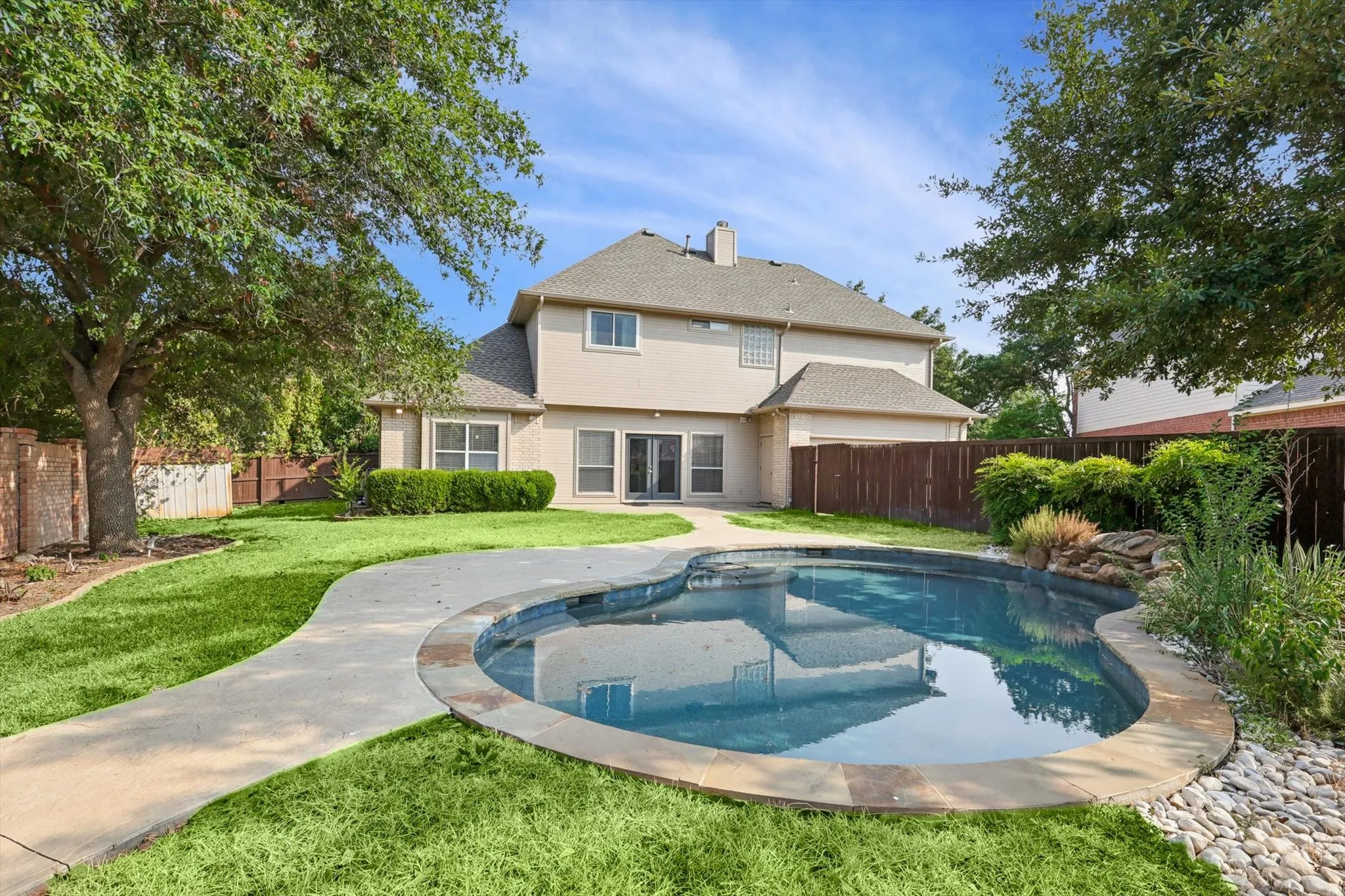 View of pool featuring a lawn