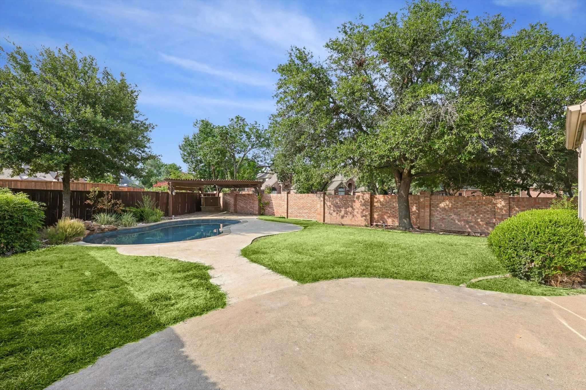 View of yard featuring a patio and a fenced in pool