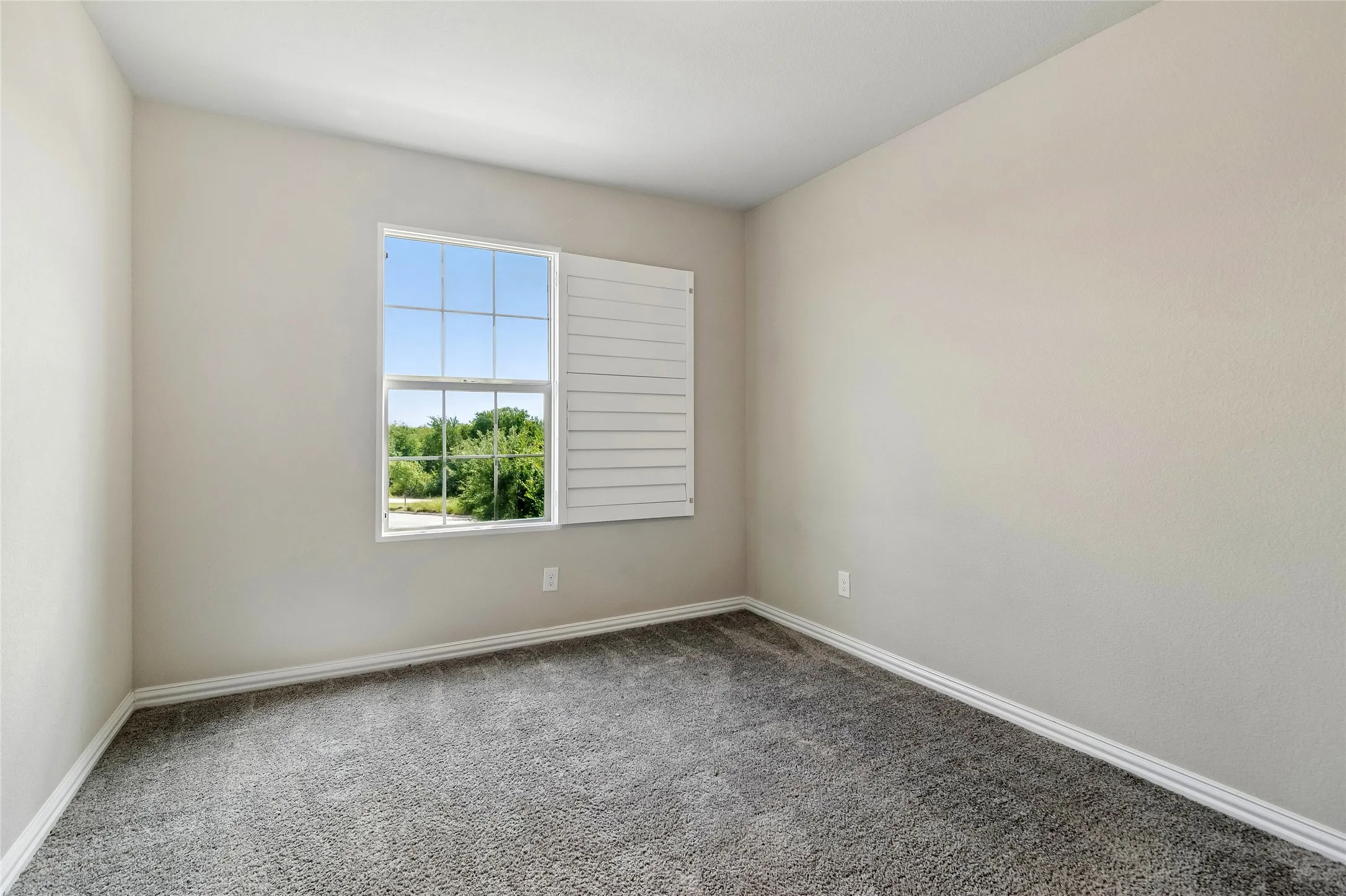 This guest bedroom has a walk in closet