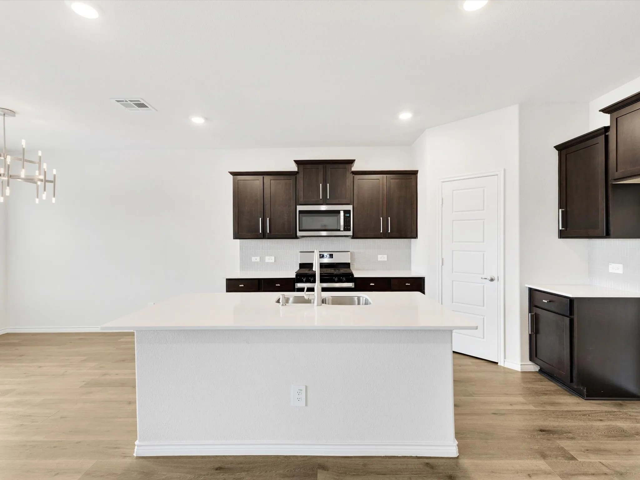 Kitchen island with seating and prep space.