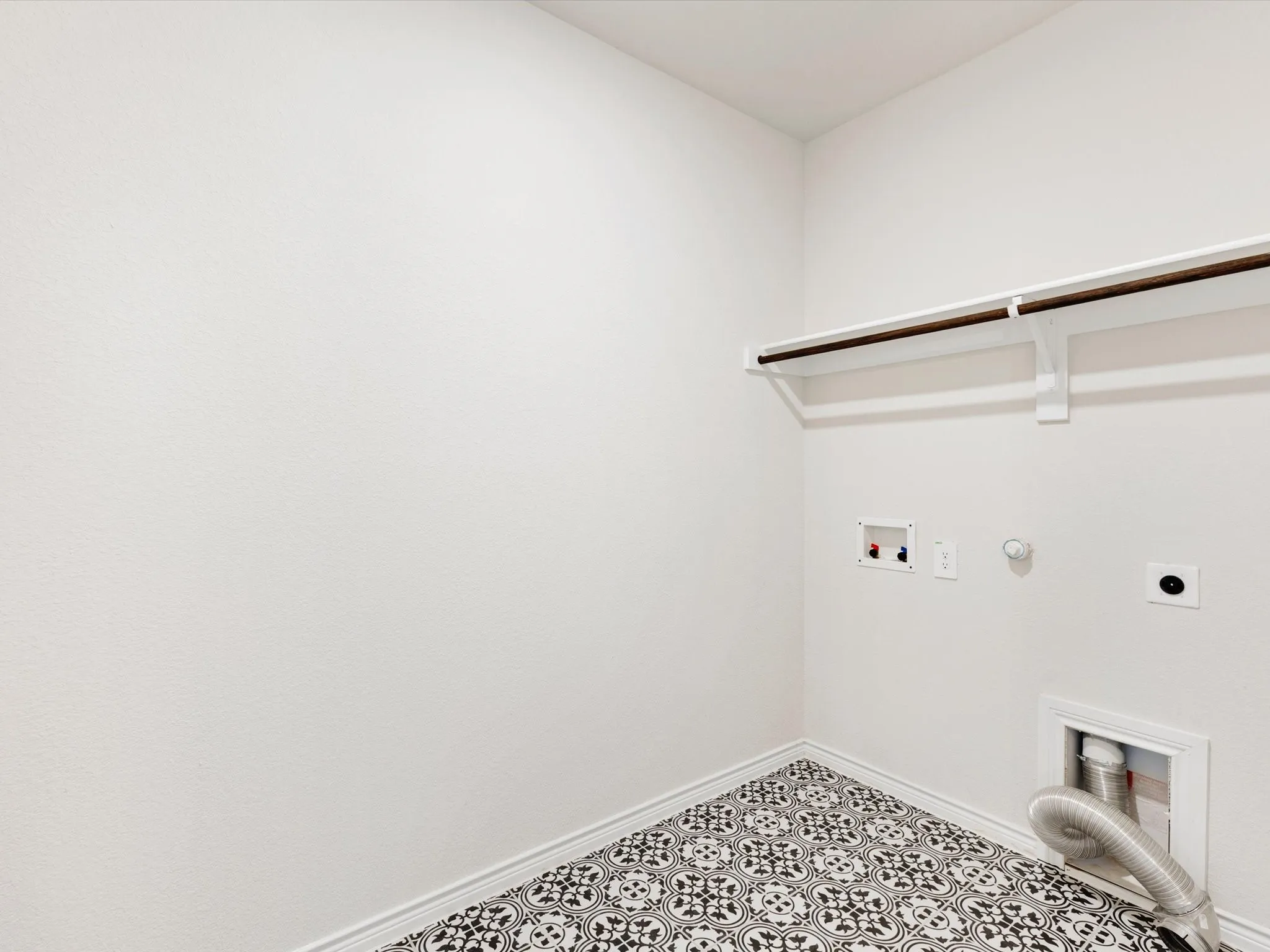 Laundry room with drip and dry hanging rods for convenient air-drying