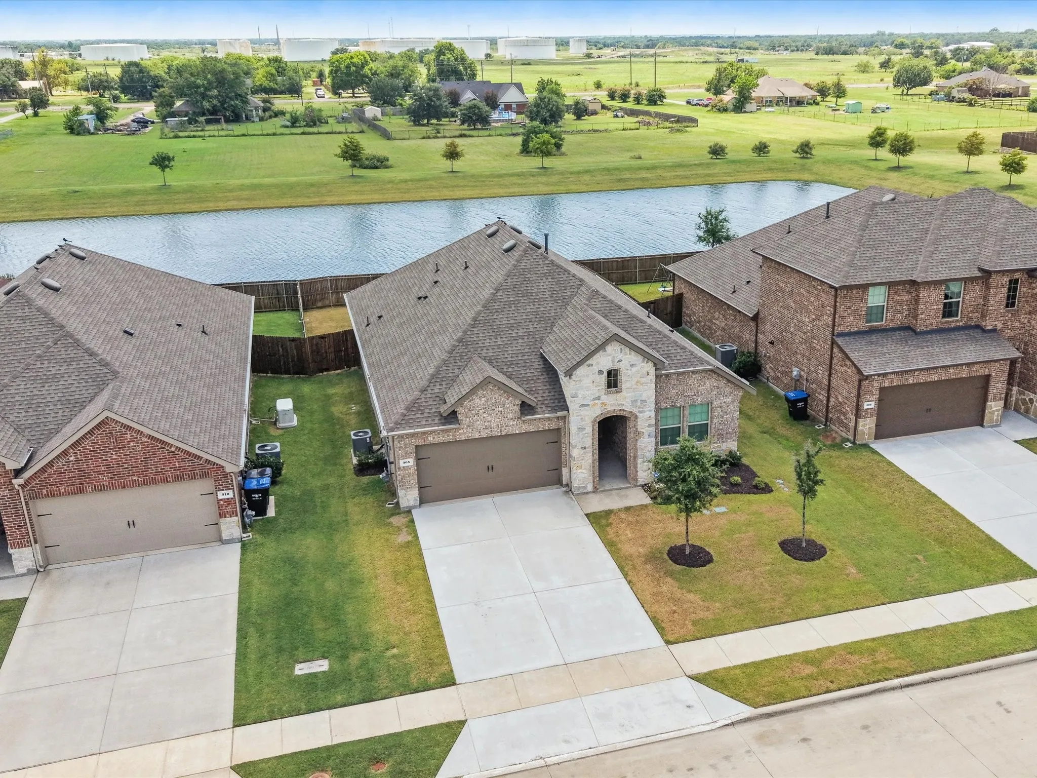 Aerial view showcasing the home's location near the community pond