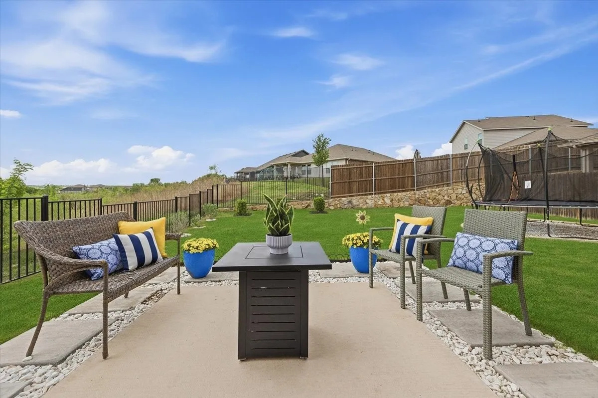 Back patio overlooks a private yard and one of a kind views, ideal for sunsets and hosting.